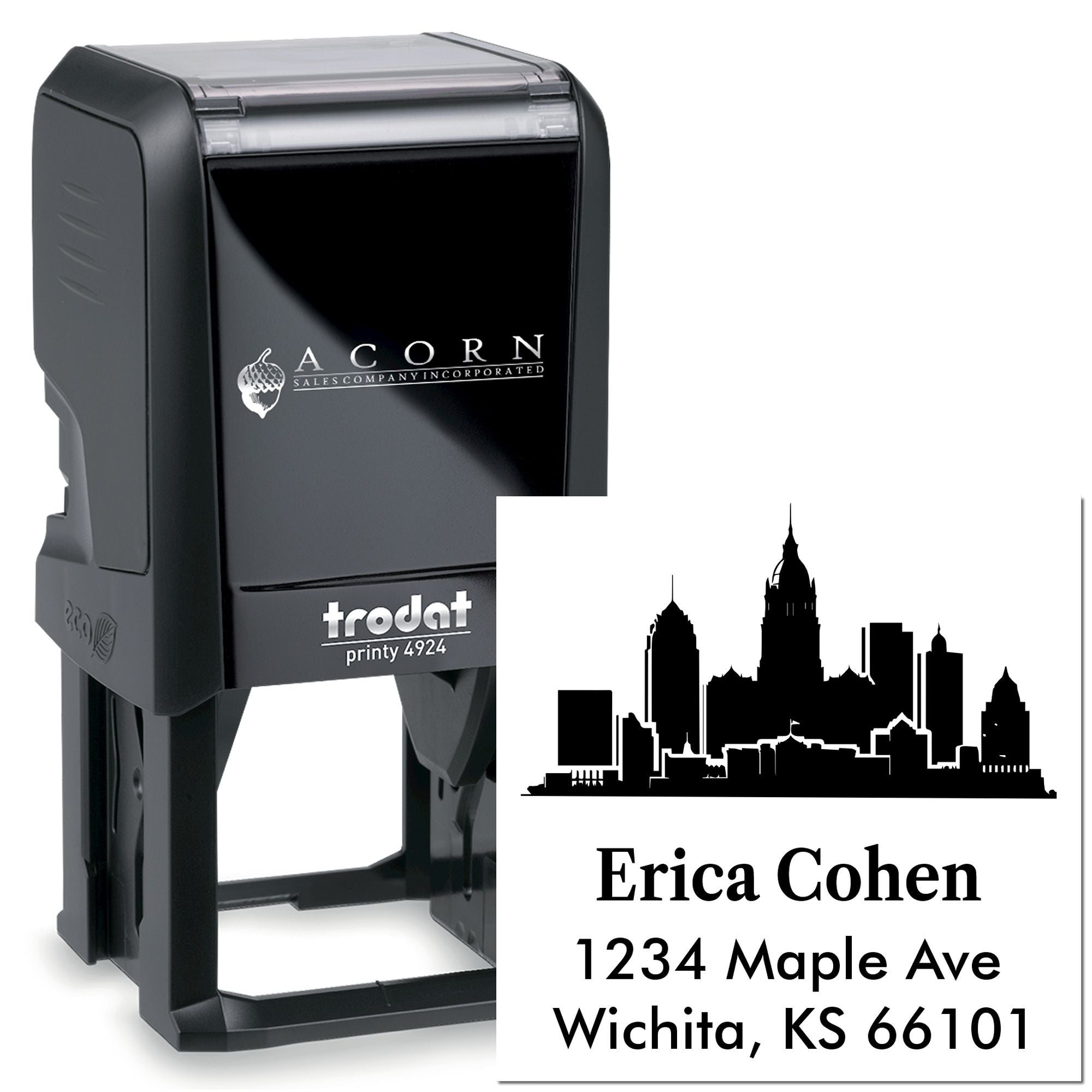 Custom self-inking rubber stamp with city skyline design and return address: Erica Cohen, 1234 Maple Ave, Wichita, KS 66101.