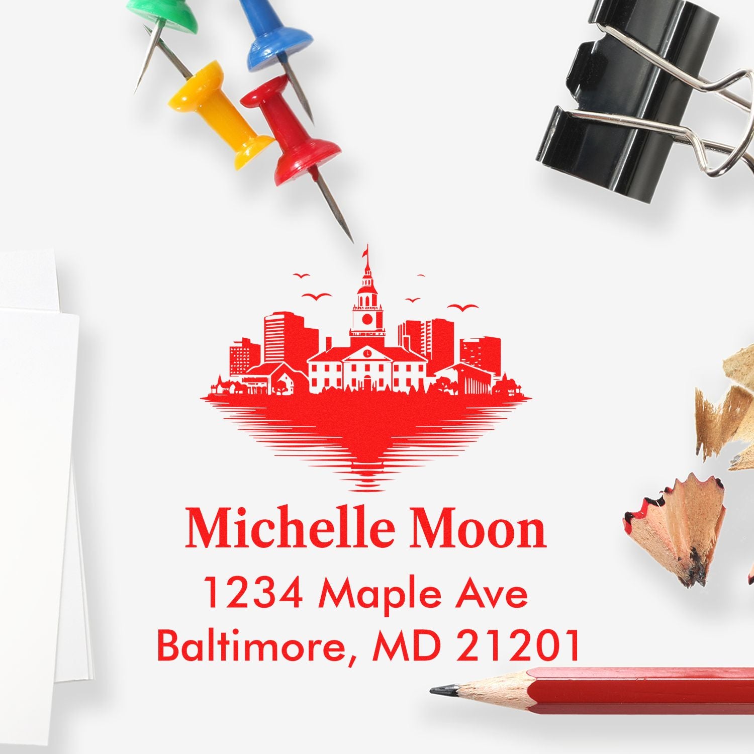 Custom return address rubber stamp with Baltimore skyline, Michelle Moon, 1234 Maple Ave, Baltimore, MD 21201 in red ink
