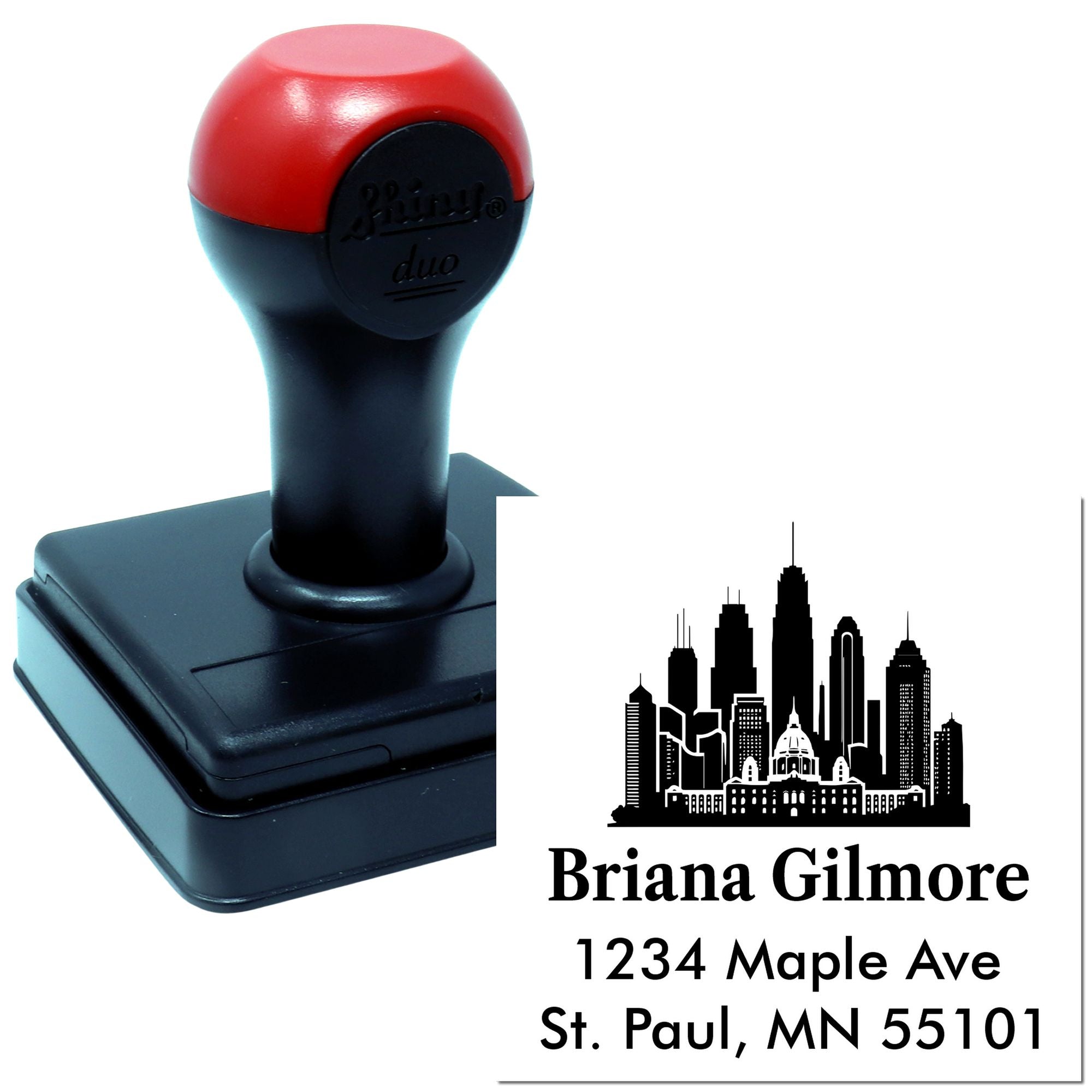 Custom self-inking rubber address stamp with skyline logo for personalized business mail and return address use.