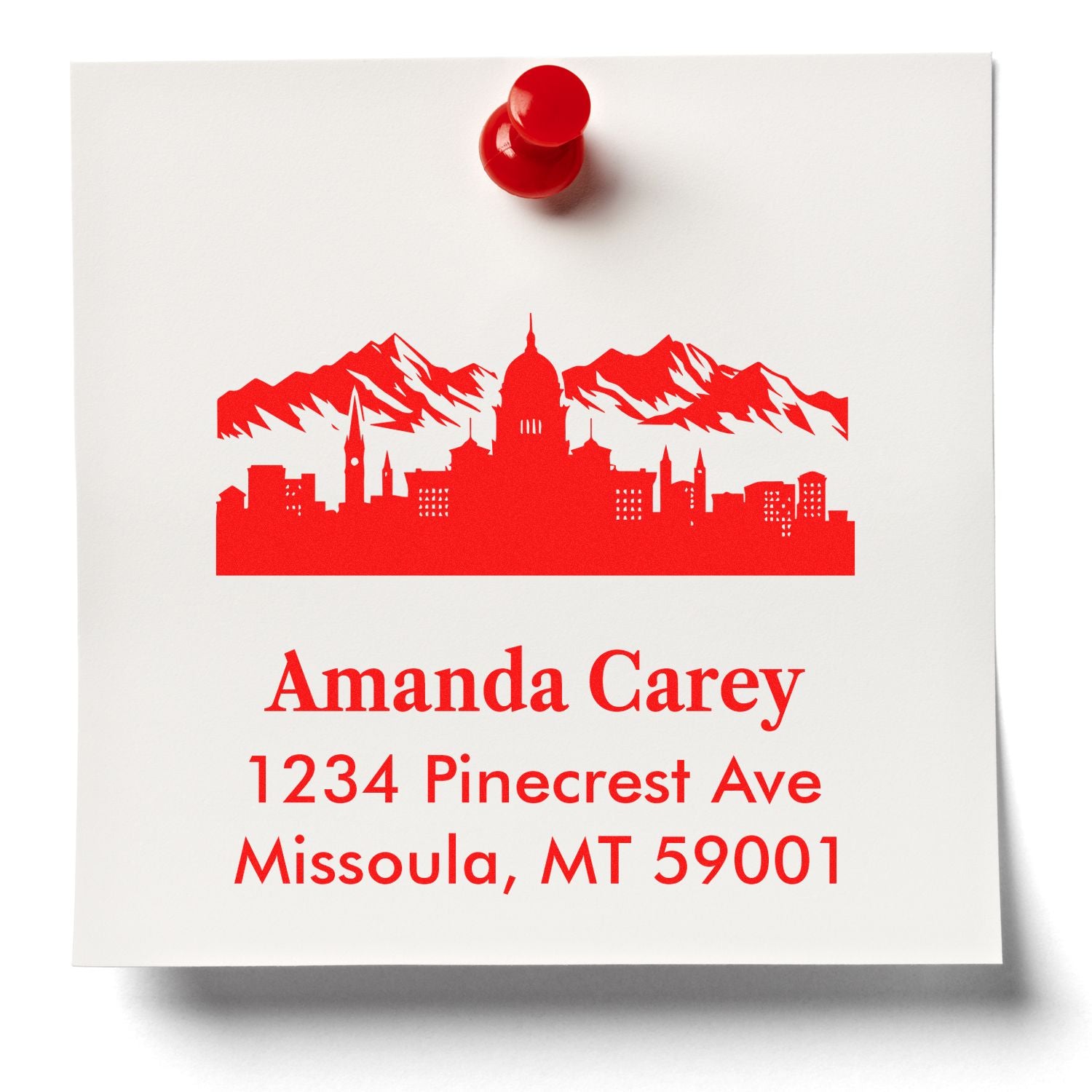 Custom rubber address stamp with red city skyline for Amanda Carey, 1234 Pinecrest Ave, Missoula, MT 59001