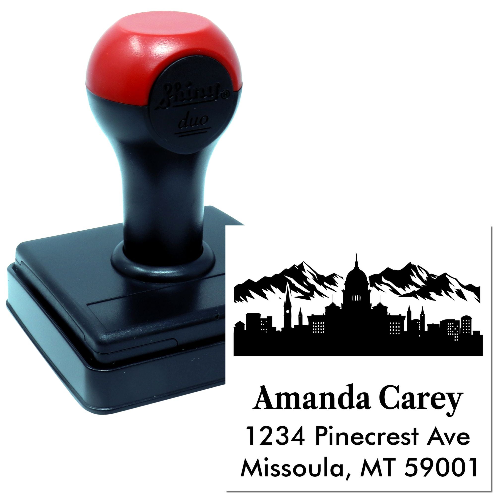 Custom self-inking rubber address stamp with mountain skyline design and personalized name and Missoula, MT return address.