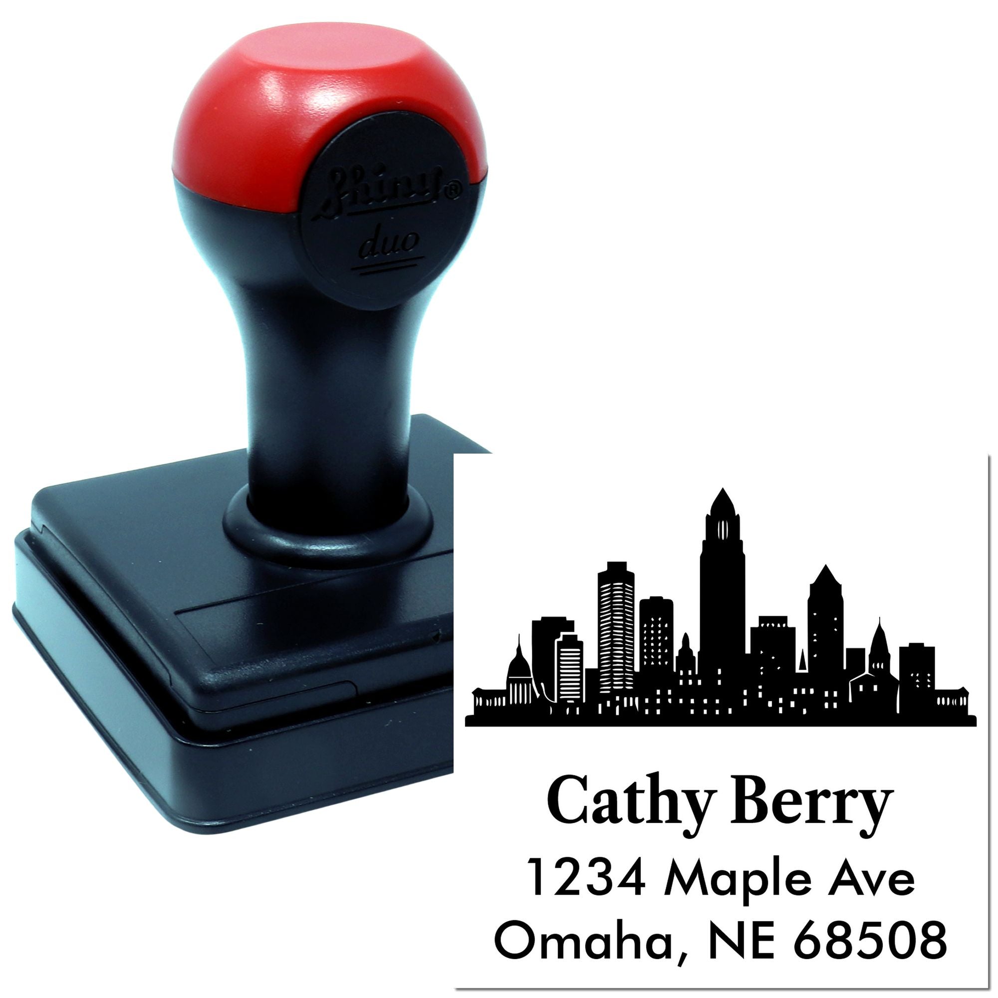 Custom self-inking rubber stamp with skyline logo and return address for personalized business mailing.