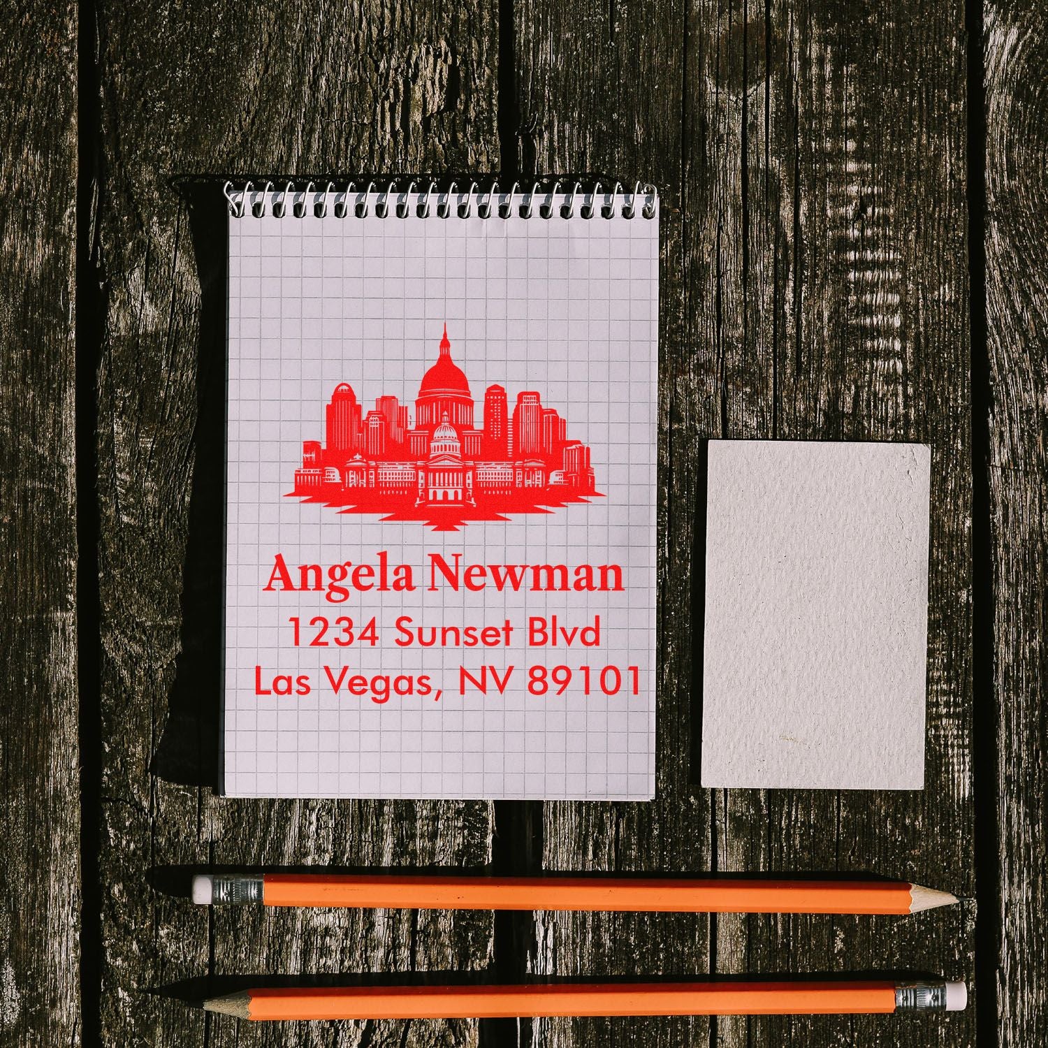 Personalized address rubber stamp with skyline logo, Angela Newman Las Vegas NV, ideal for envelope and mail branding.