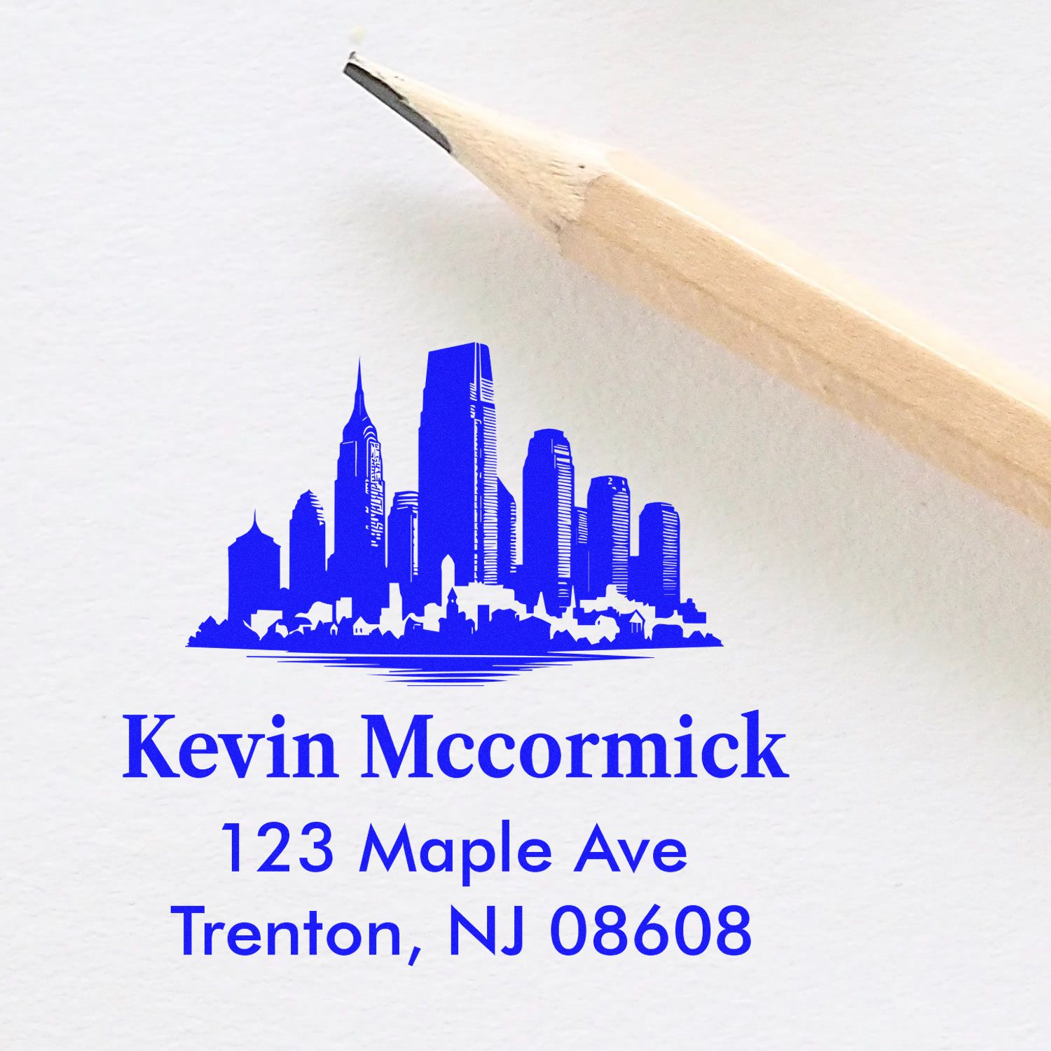 Custom rubber address stamp with city skyline logo for Kevin Mccormick, 123 Maple Ave, Trenton, NJ 08608