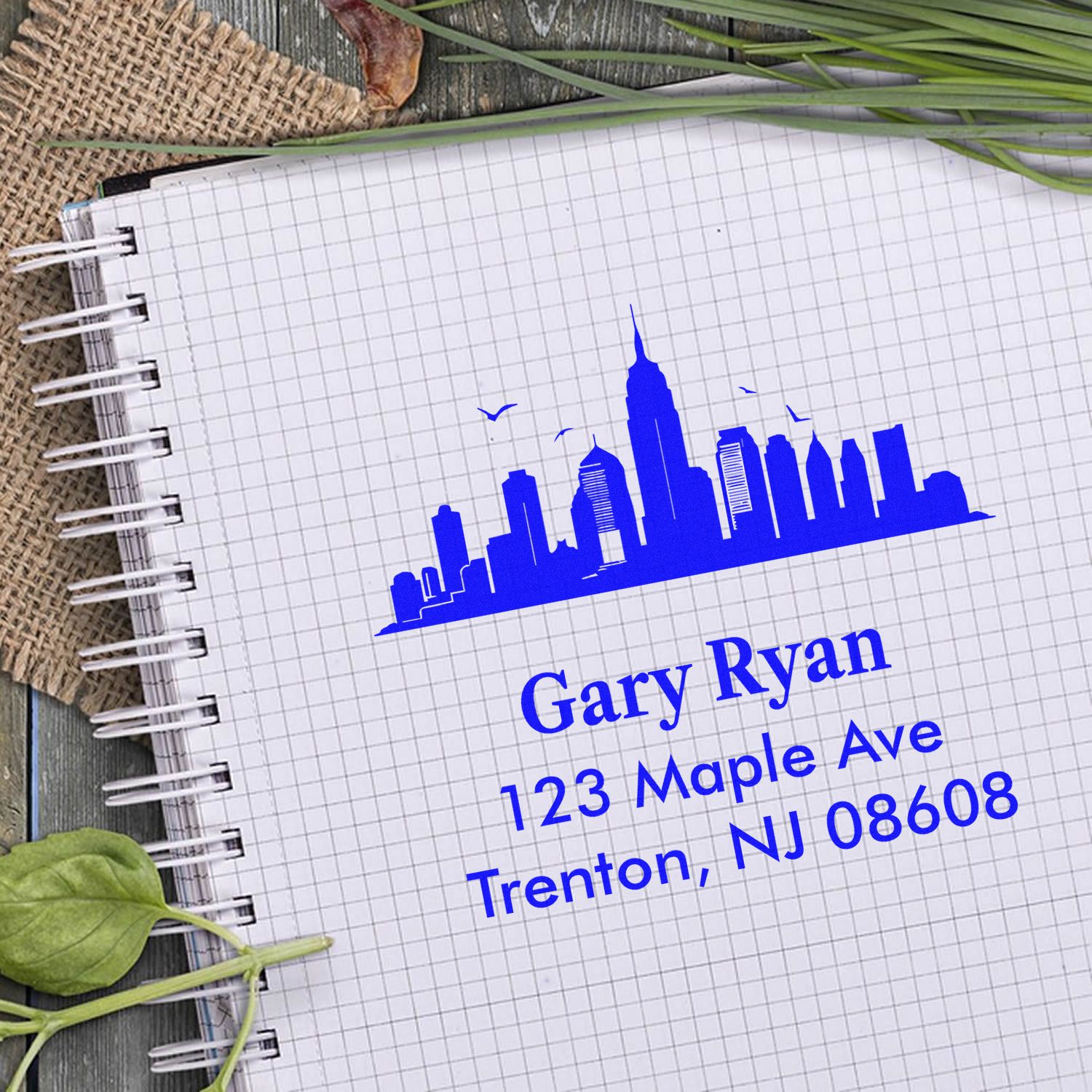 Custom address rubber stamp impression with skyline design for Gary Ryan, 123 Maple Ave, Trenton, NJ 08608.