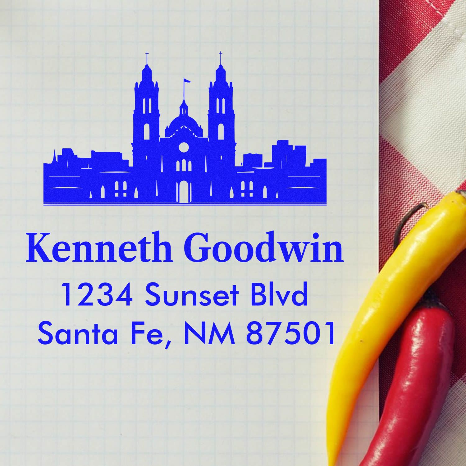 Custom return address rubber stamp for Kenneth Goodwin, Santa Fe, NM 87501, with cathedral skyline design.