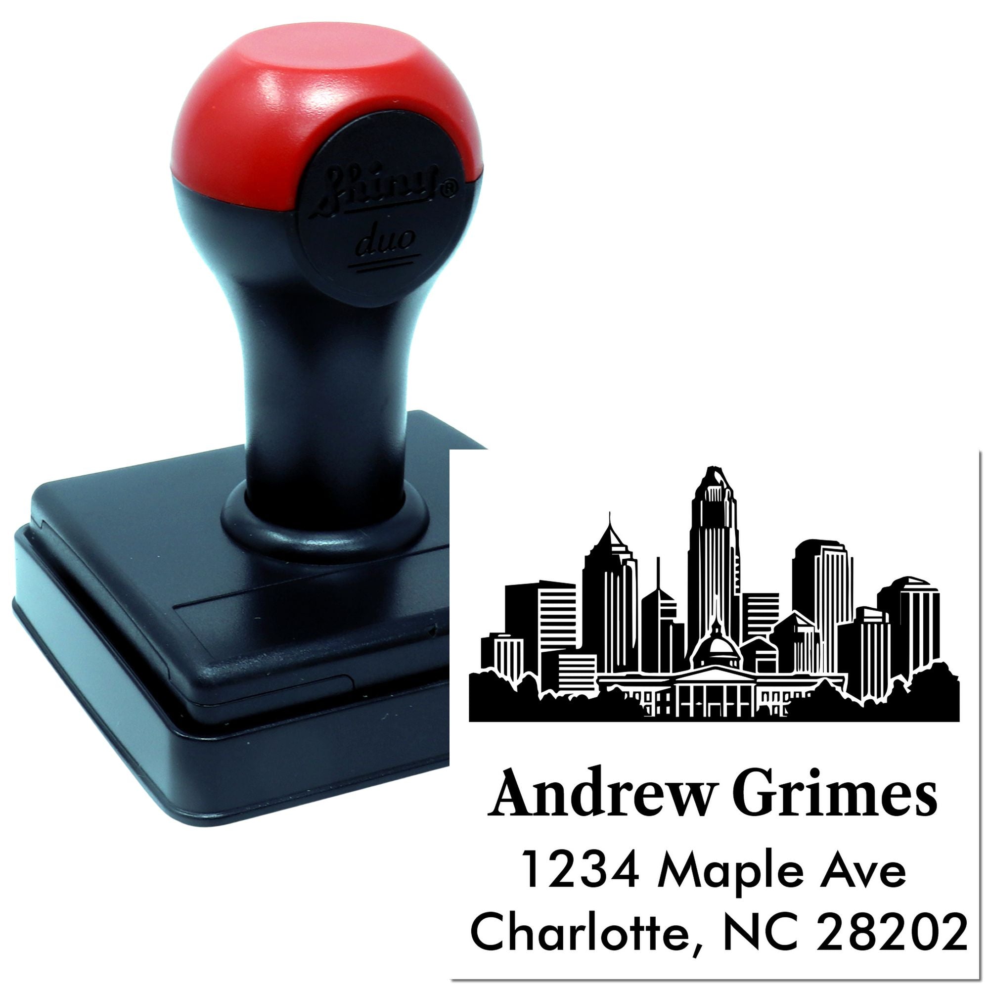 Custom self-inking rubber return address stamp with skyline for Andrew Grimes, 1234 Maple Ave, Charlotte, NC 28202.