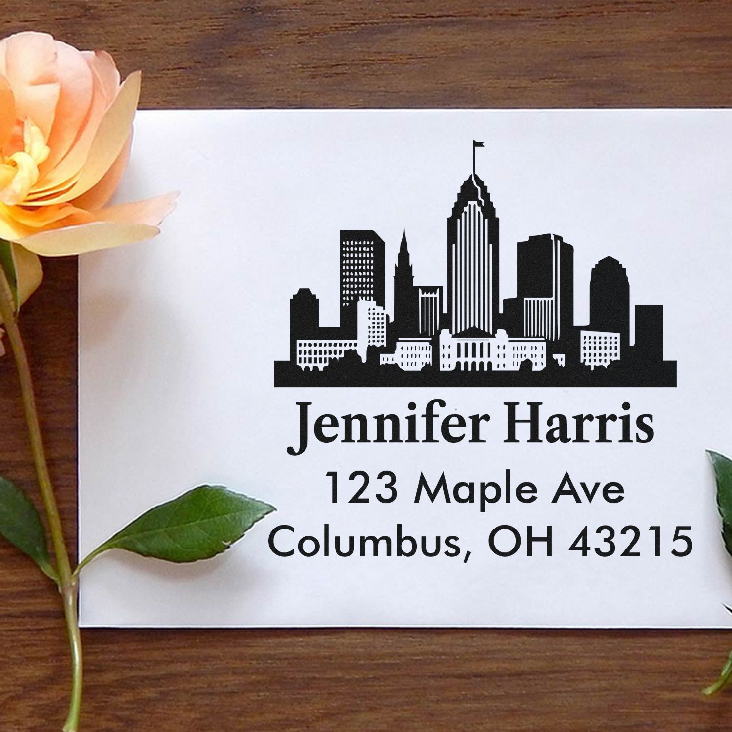 Custom address rubber stamp with Columbus, OH skyline, Jennifer Harris name, and 123 Maple Ave return address.
