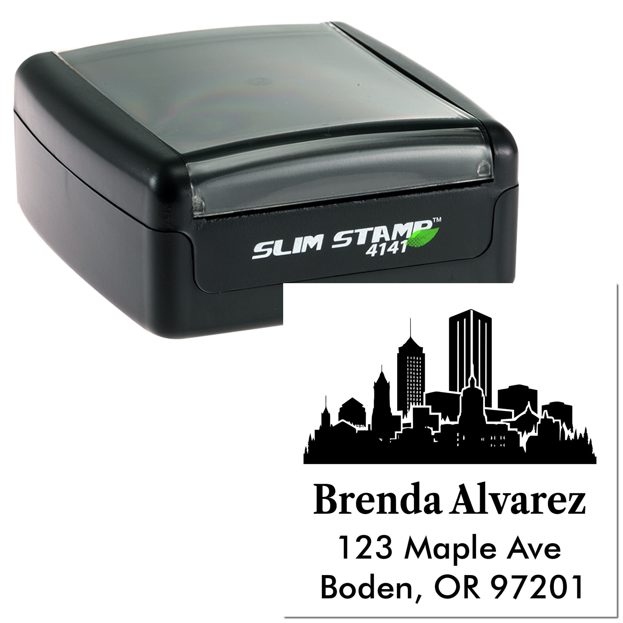 Self-inking custom rubber address stamp with city skyline design, showing Brenda Alvarez name and Oregon address.