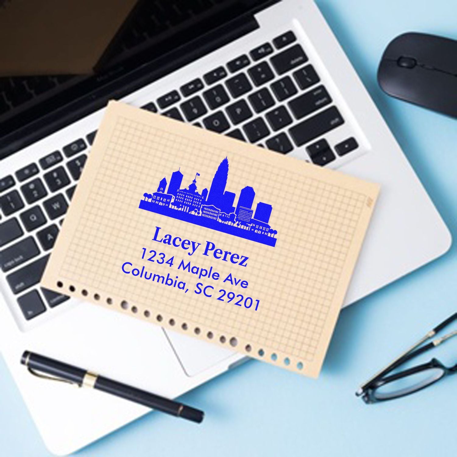 Personalized return address rubber stamp with city skyline, printed on an envelope for Lacey Perez in Columbia, SC.