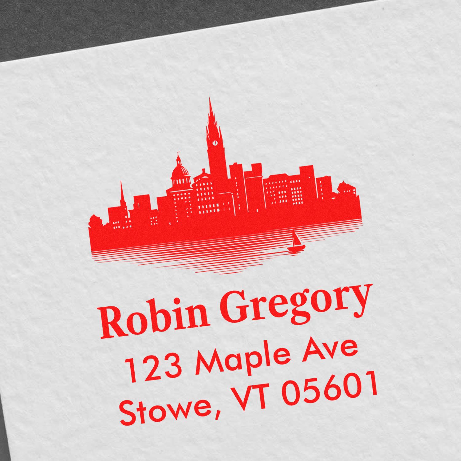 Custom return address rubber stamp with skyline design for Robin Gregory, 123 Maple Ave, Stowe, VT 05601