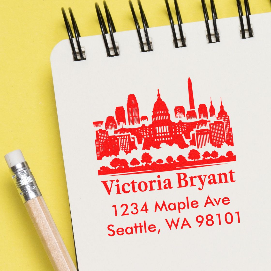 Custom return address rubber stamp with Seattle skyline for Victoria Bryant, 1234 Maple Ave, Seattle, WA 98101.