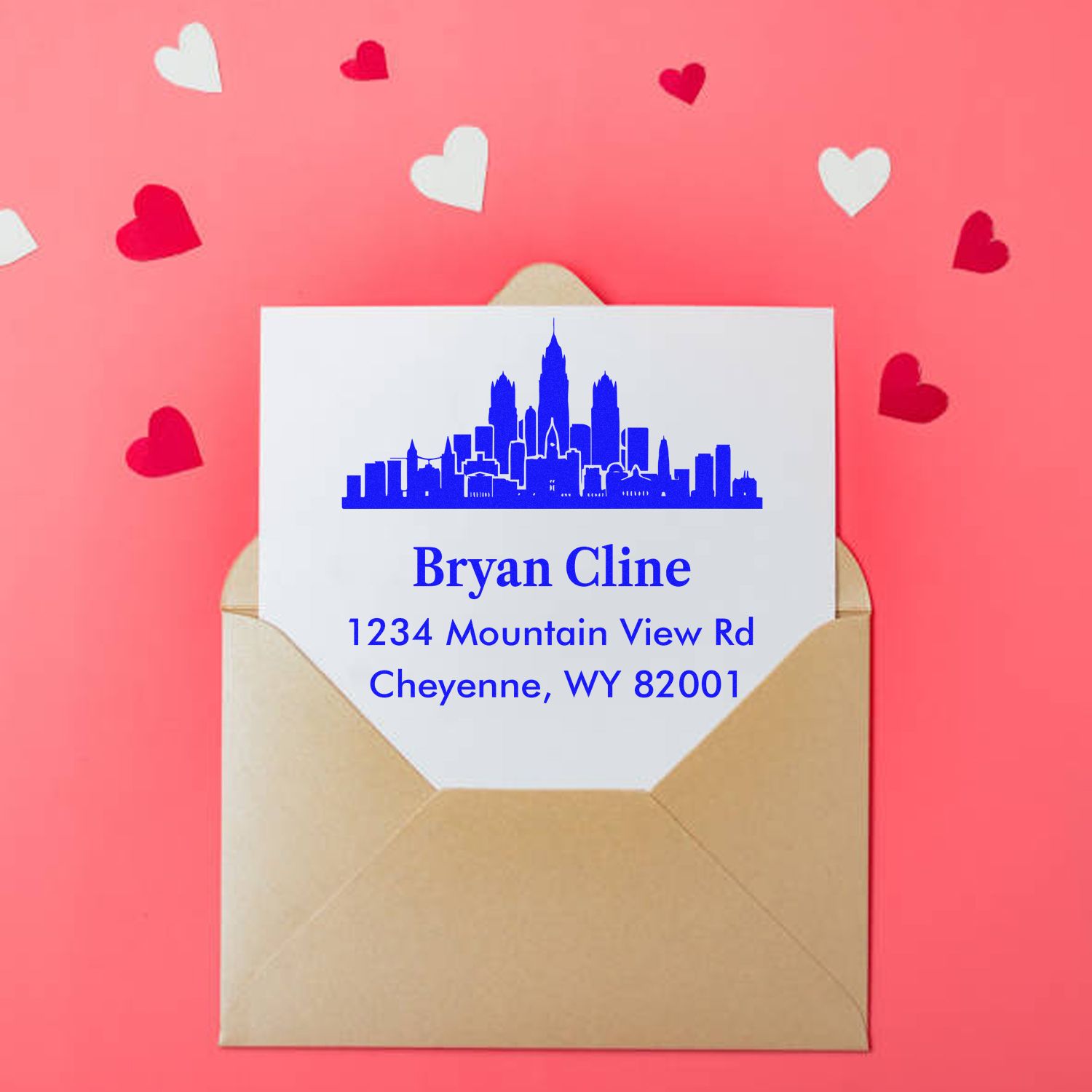 Custom return address rubber stamp with skyline design on envelope for Bryan Cline, Cheyenne, WY.