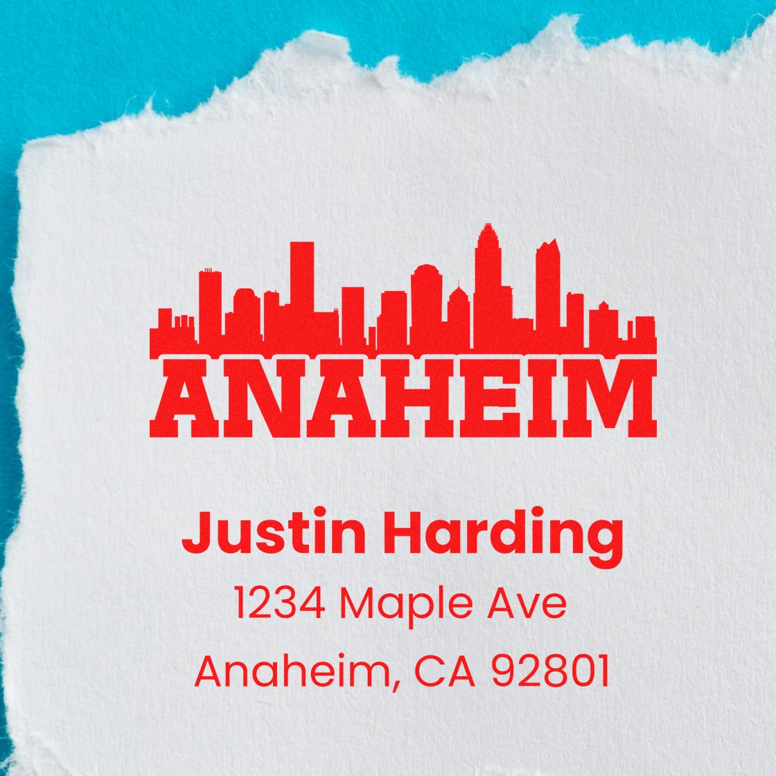 Custom Anaheim return address rubber stamp with skyline, Justin Harding name, and mailing address on torn paper.