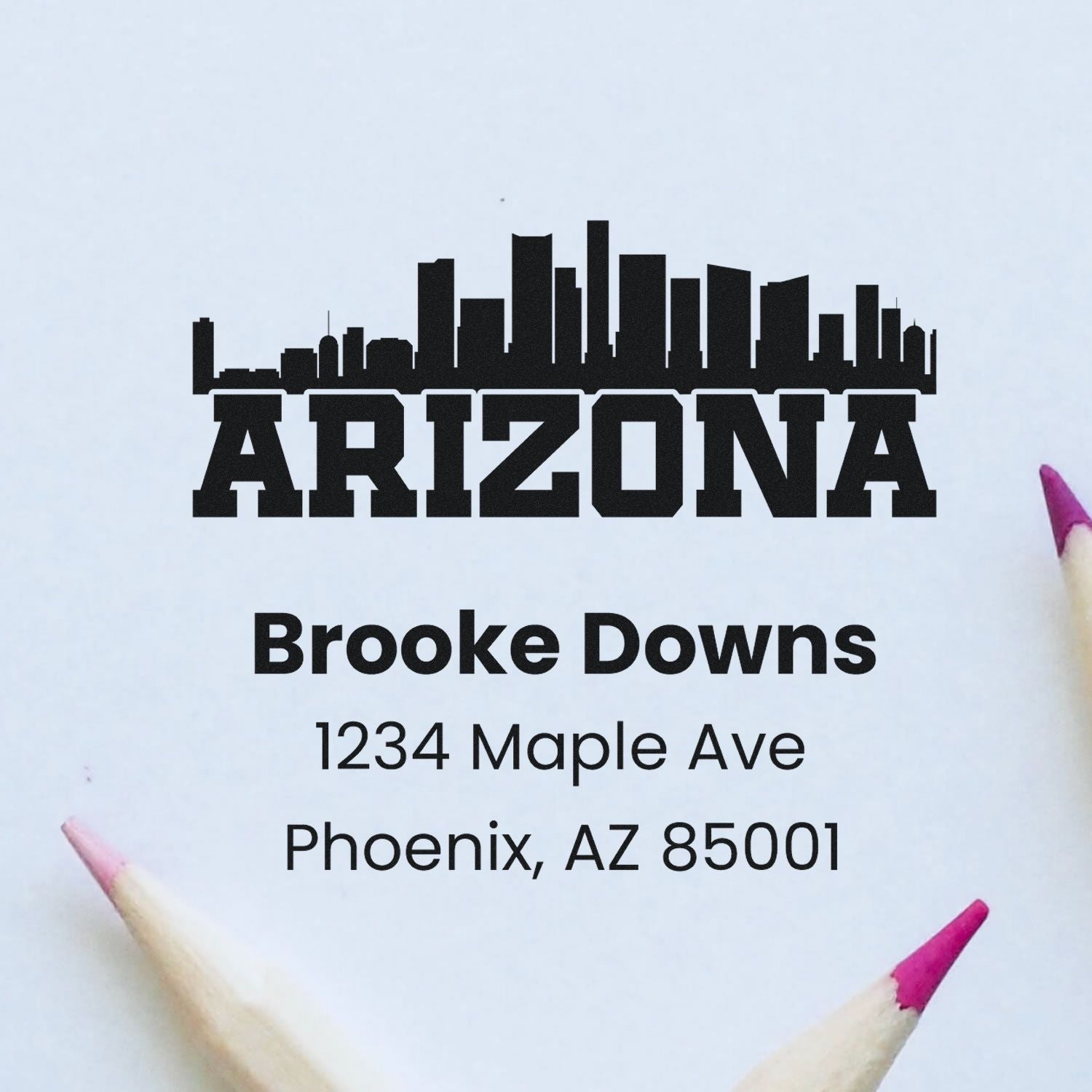 Custom Arizona address rubber stamp with skyline logo for Brooke Downs, 1234 Maple Ave, Phoenix, AZ 85001.