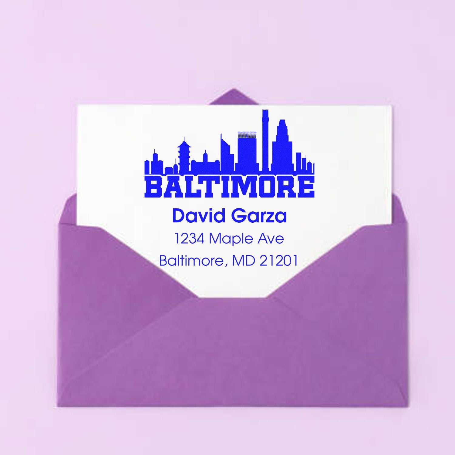 Custom Baltimore return address rubber stamp with skyline design for David Garza, 1234 Maple Ave, Baltimore, MD 21201.