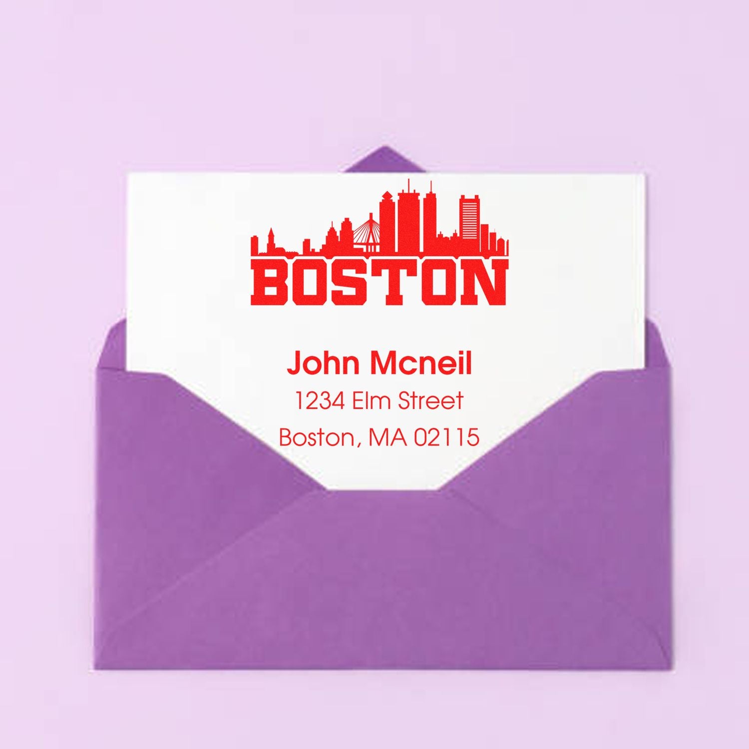 Custom Boston return address rubber stamp on envelope with skyline, name, and address for mailing.