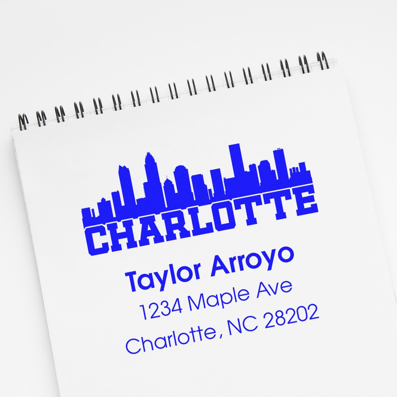 Custom Charlotte, NC address rubber stamp with skyline logo for business branding