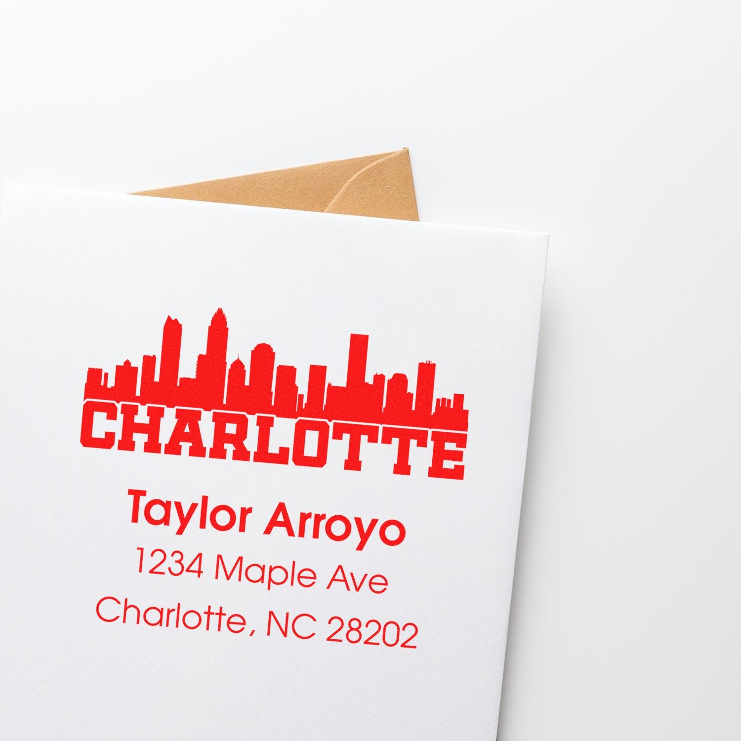 Custom Charlotte return address rubber stamp with skyline, Taylor Arroyo, 1234 Maple Ave, Charlotte, NC 28202.