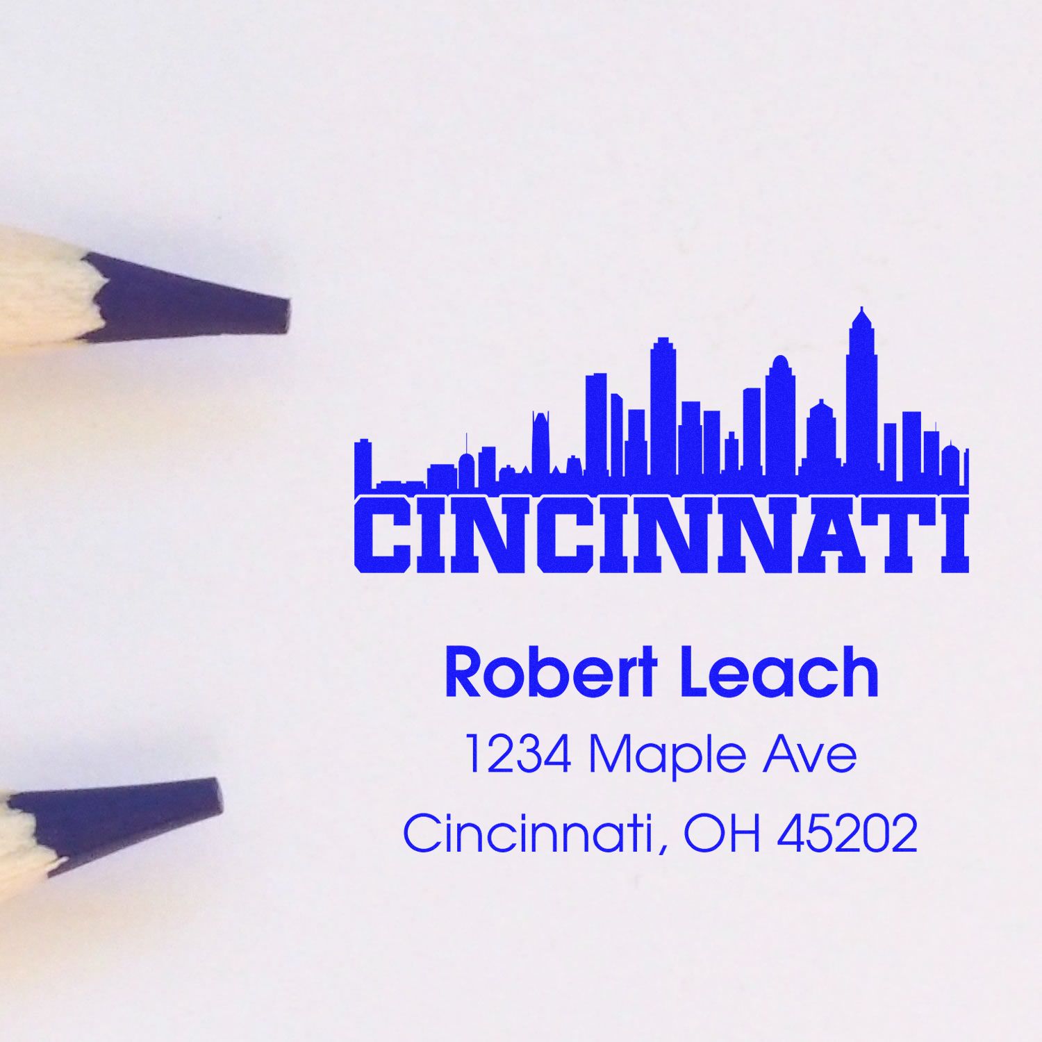 Custom Cincinnati address rubber stamp with skyline, name, and mailing address for personal stationery.