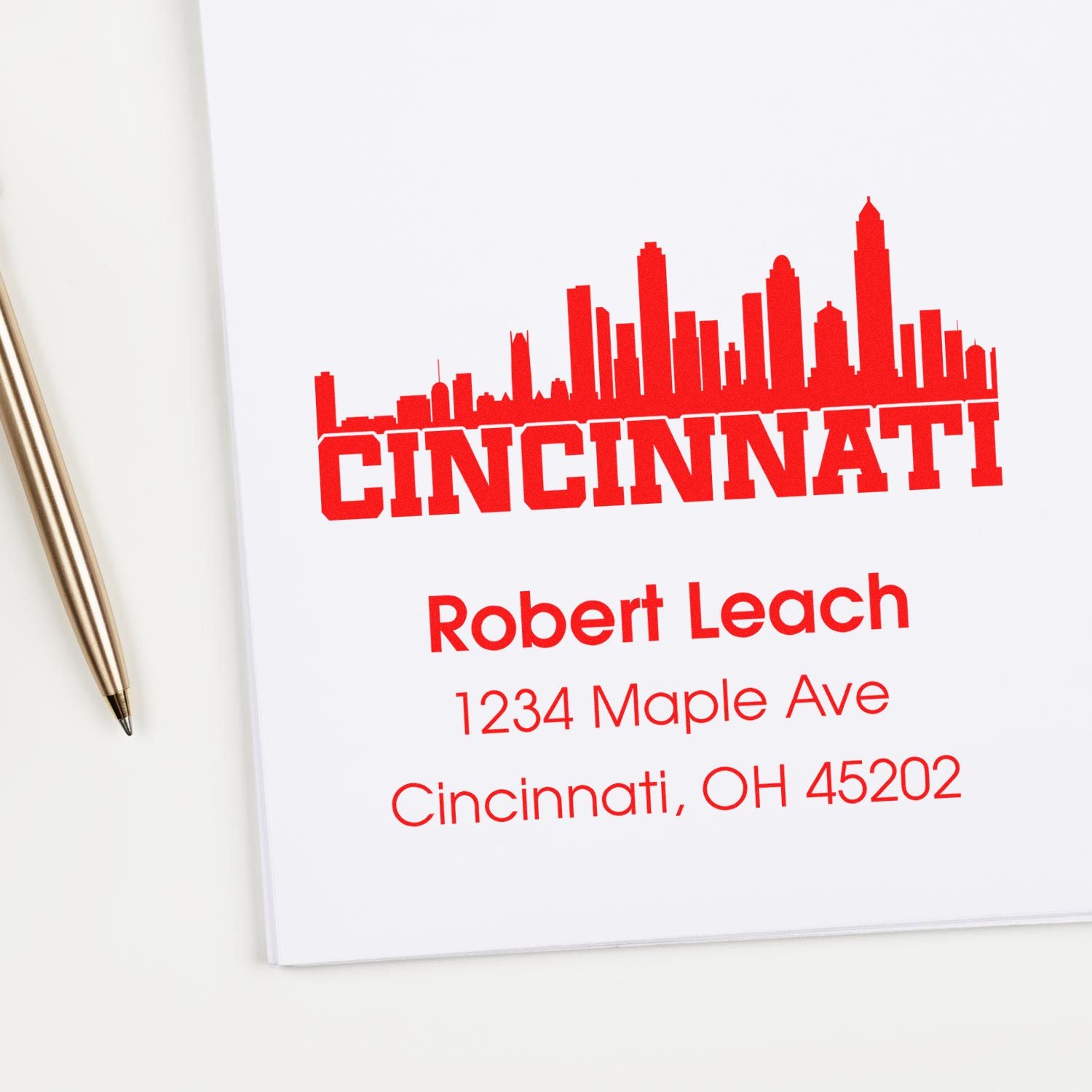 Custom Cincinnati rubber stamp with skyline, name, and address for personalized business mail and branding.