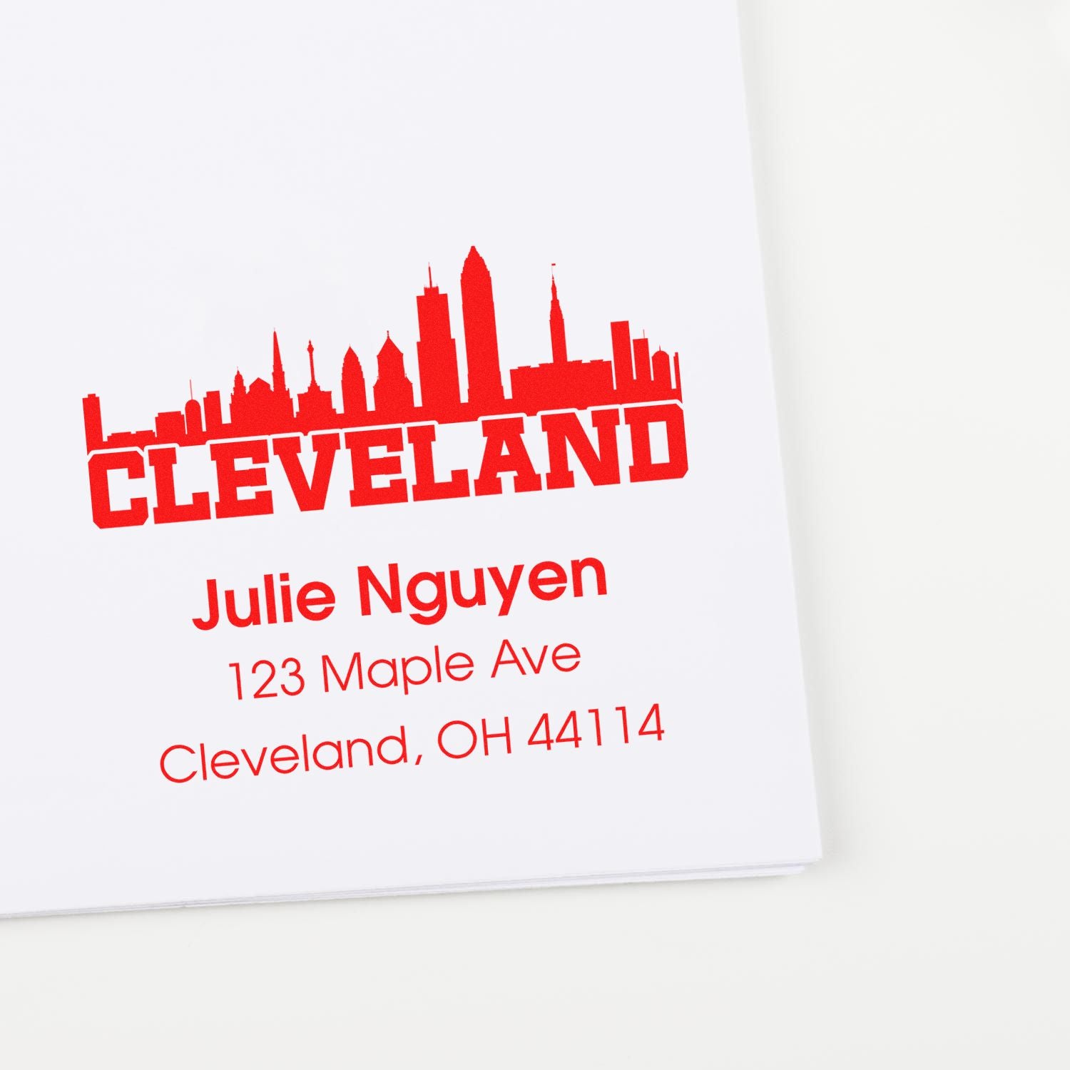 Custom Cleveland rubber stamp with skyline, name, and address for personalized return mail or business use.
