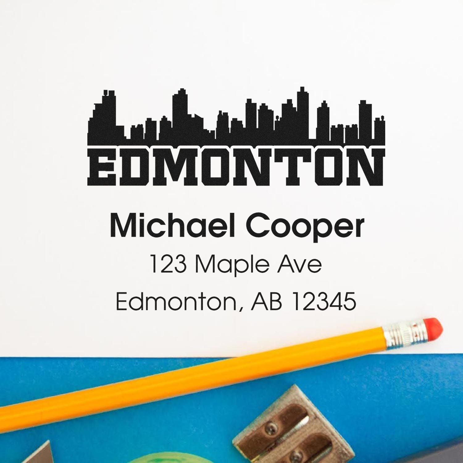 Custom Edmonton skyline address rubber stamp with Michael Cooper name and mailing address.