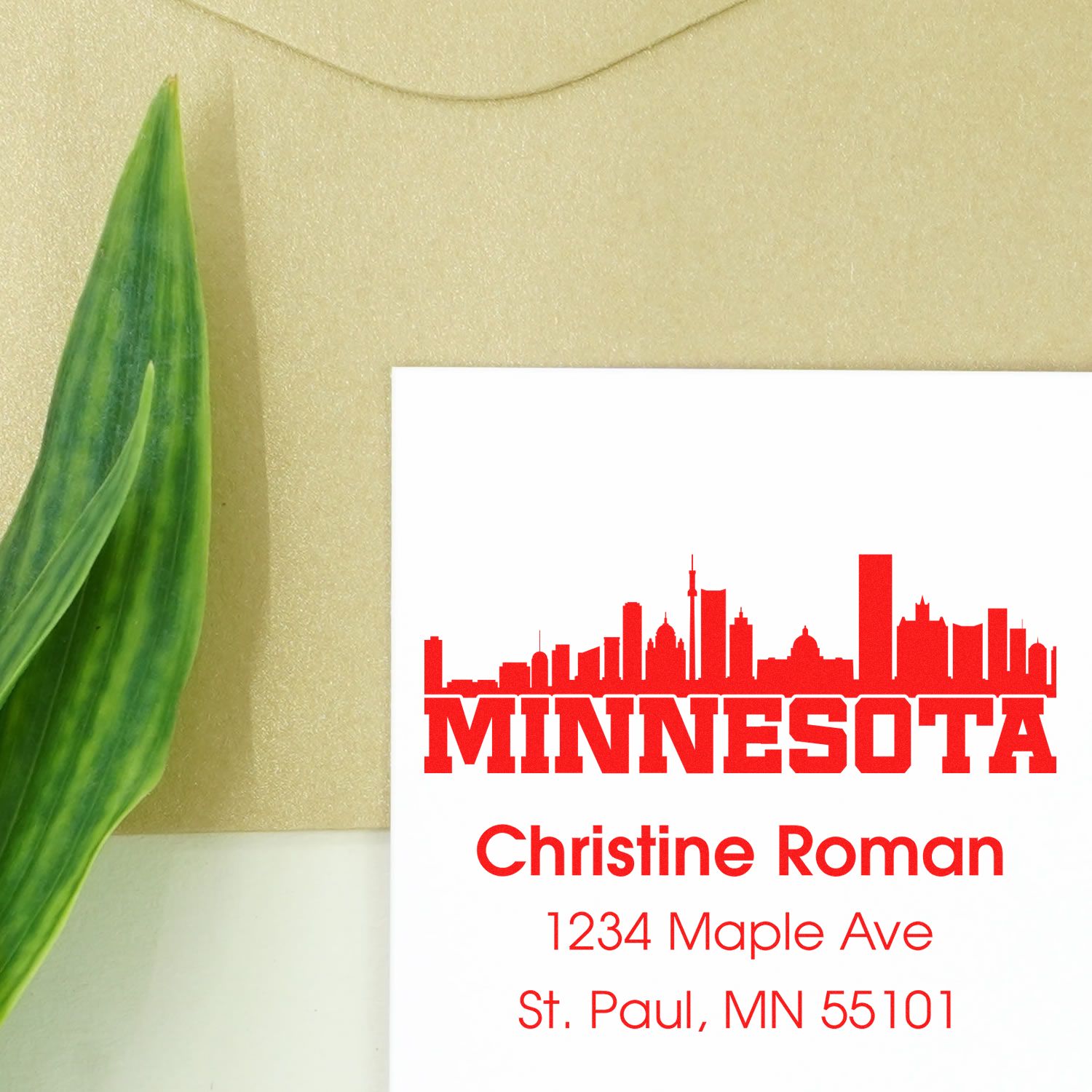 Custom Minnesota skyline address rubber stamp with Christine Roman's name and St. Paul, MN mailing address.