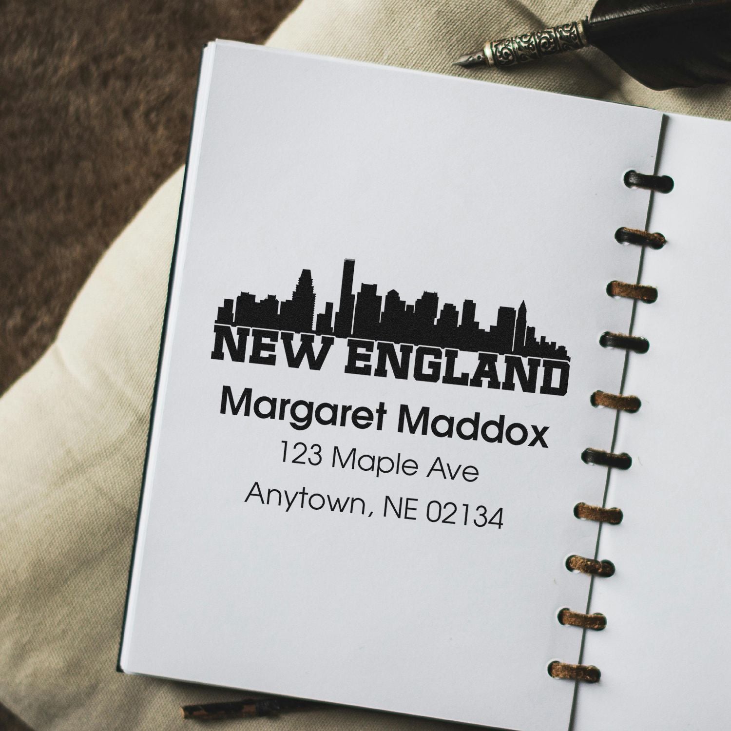 Custom New England address rubber stamp with skyline design for personalized stationery and mailing.