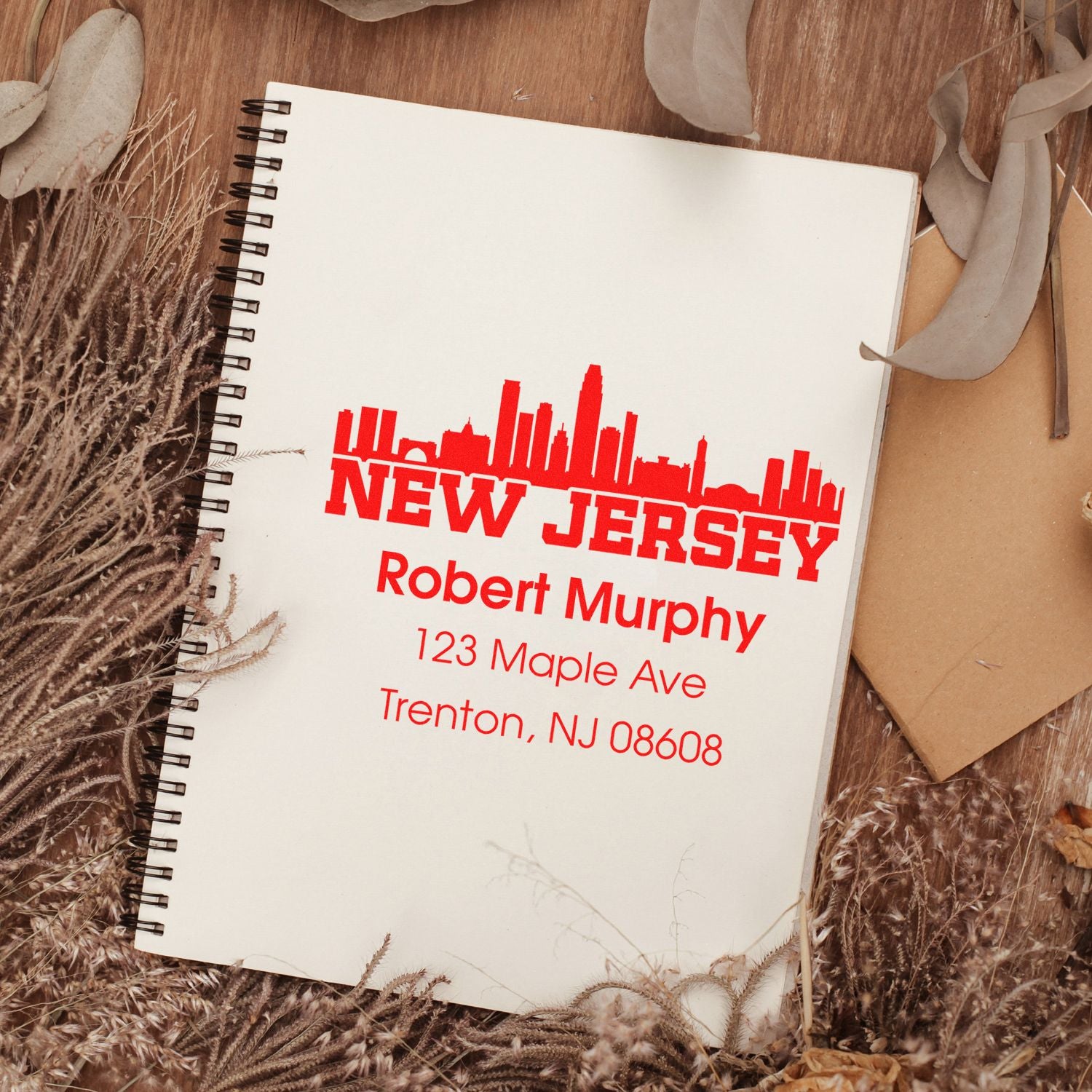 Custom New Jersey address rubber stamp with skyline design for Robert Murphy, 123 Maple Ave, Trenton, NJ 08608