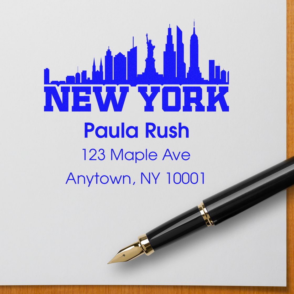 Personalized New York skyline return address rubber stamp with Paula Rush name and NY address for mailings.