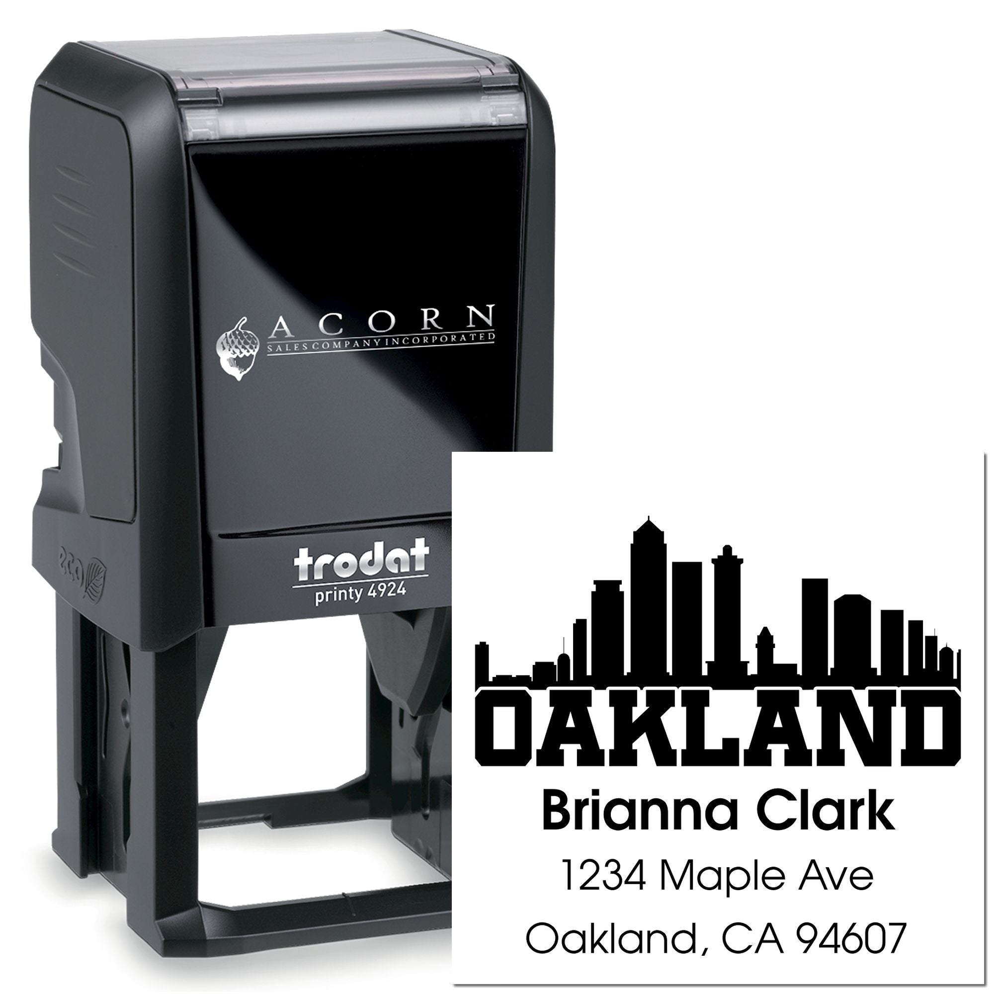 Custom self-inking rubber stamp for Oakland address imprint, featuring skyline logo and business mailing details.