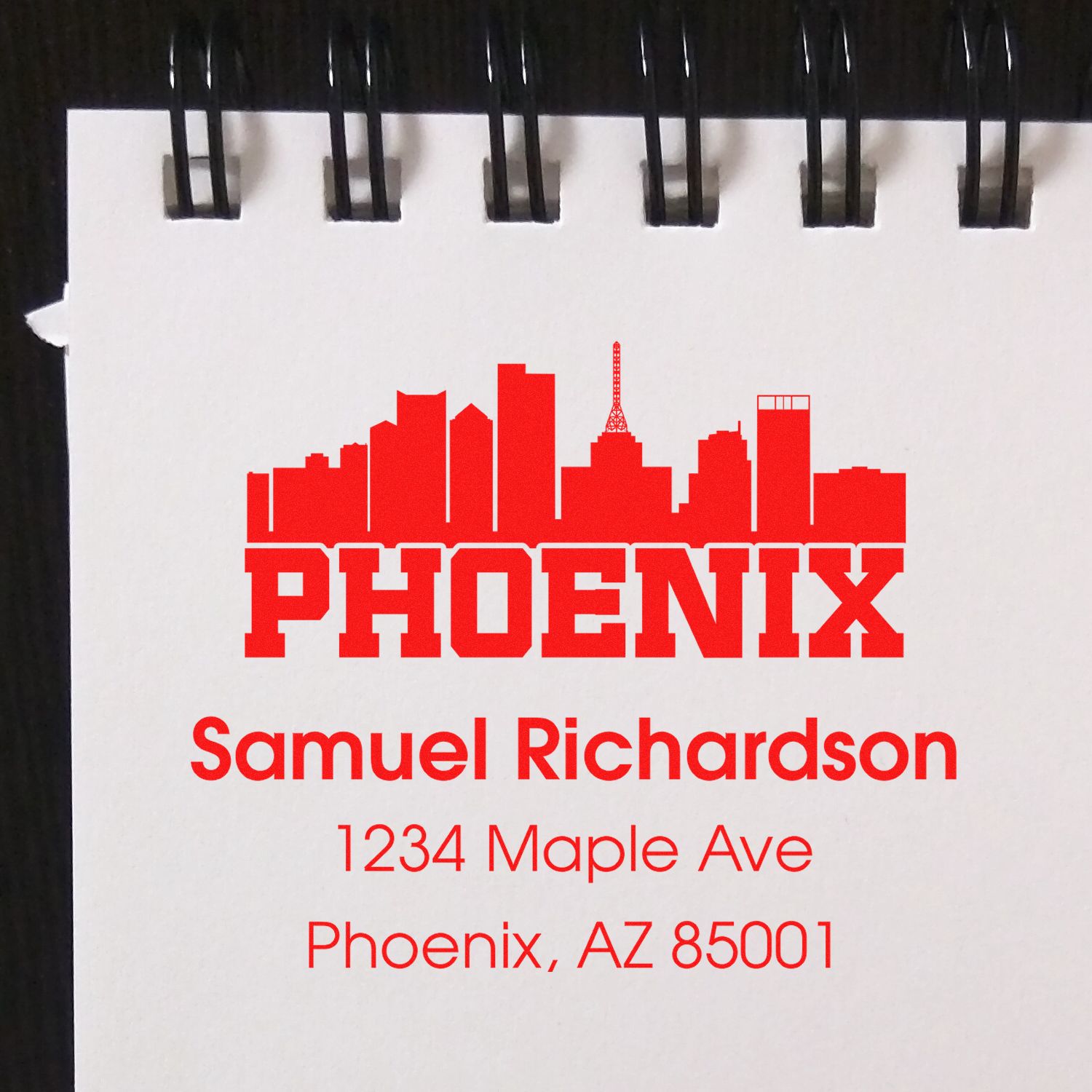 Custom Phoenix address rubber stamp with skyline logo for Samuel Richardson, 1234 Maple Ave, Phoenix, AZ 85001.