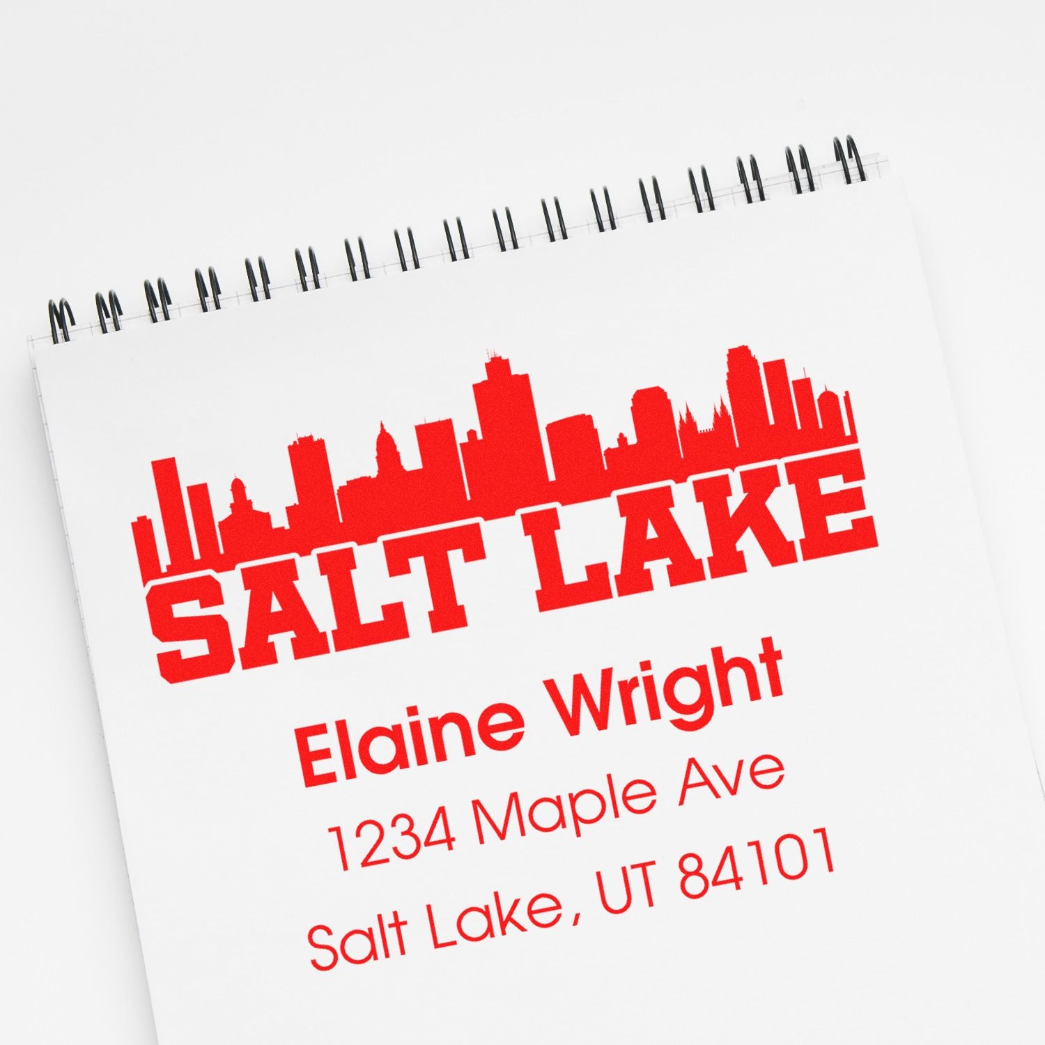 Custom Salt Lake City address rubber stamp with skyline logo, name, street address, and ZIP code for business mailings