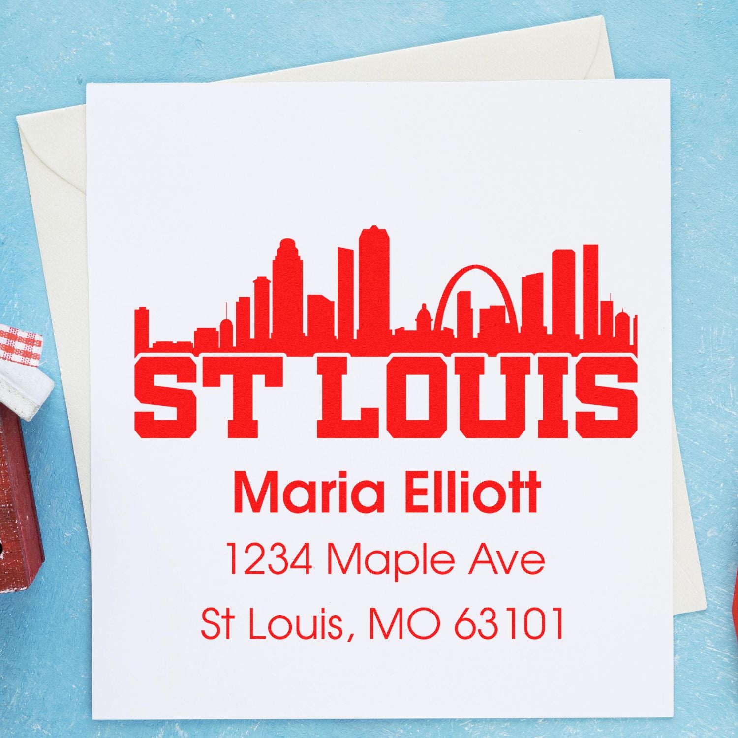 Custom St. Louis skyline return address rubber stamp with name, street address, and ZIP code for Maria Elliott.