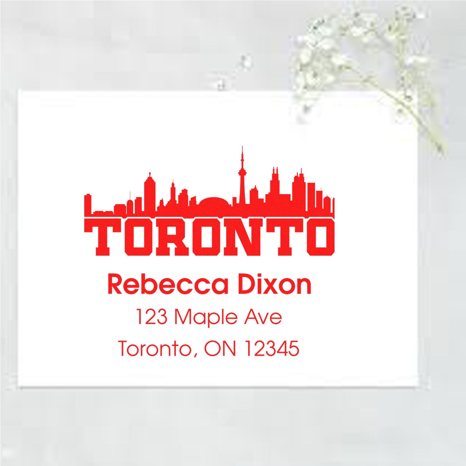 Custom Toronto address rubber stamp with skyline, Rebecca Dixon, and return mailing address for envelopes and stationery.