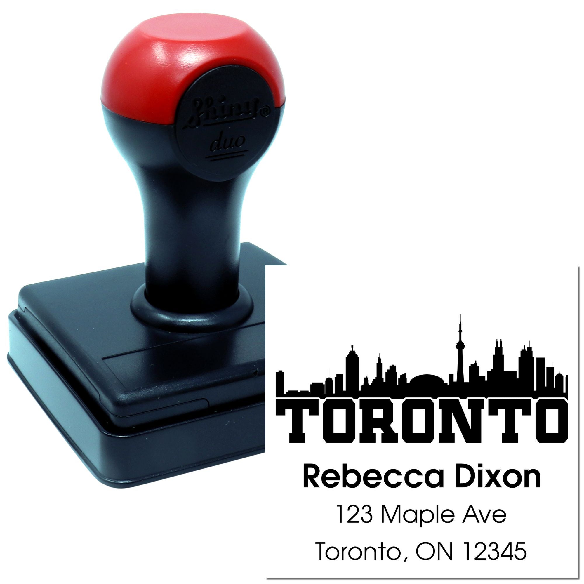 Self-inking Toronto return address rubber stamp with skyline, personalized for Rebecca Dixon at 123 Maple Ave.