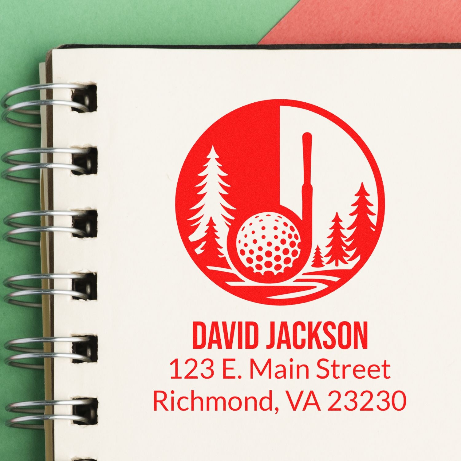 Custom golf rubber stamp with name and address, featuring a golf ball logo on a notebook page.