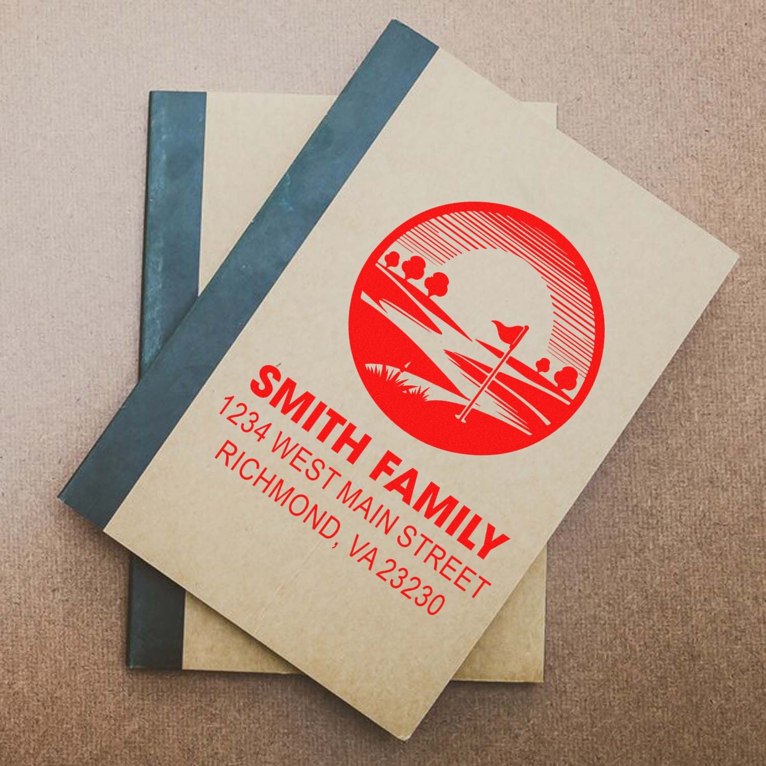 Custom rubber stamp on notebook cover featuring Smith Family return address and personalized logo.