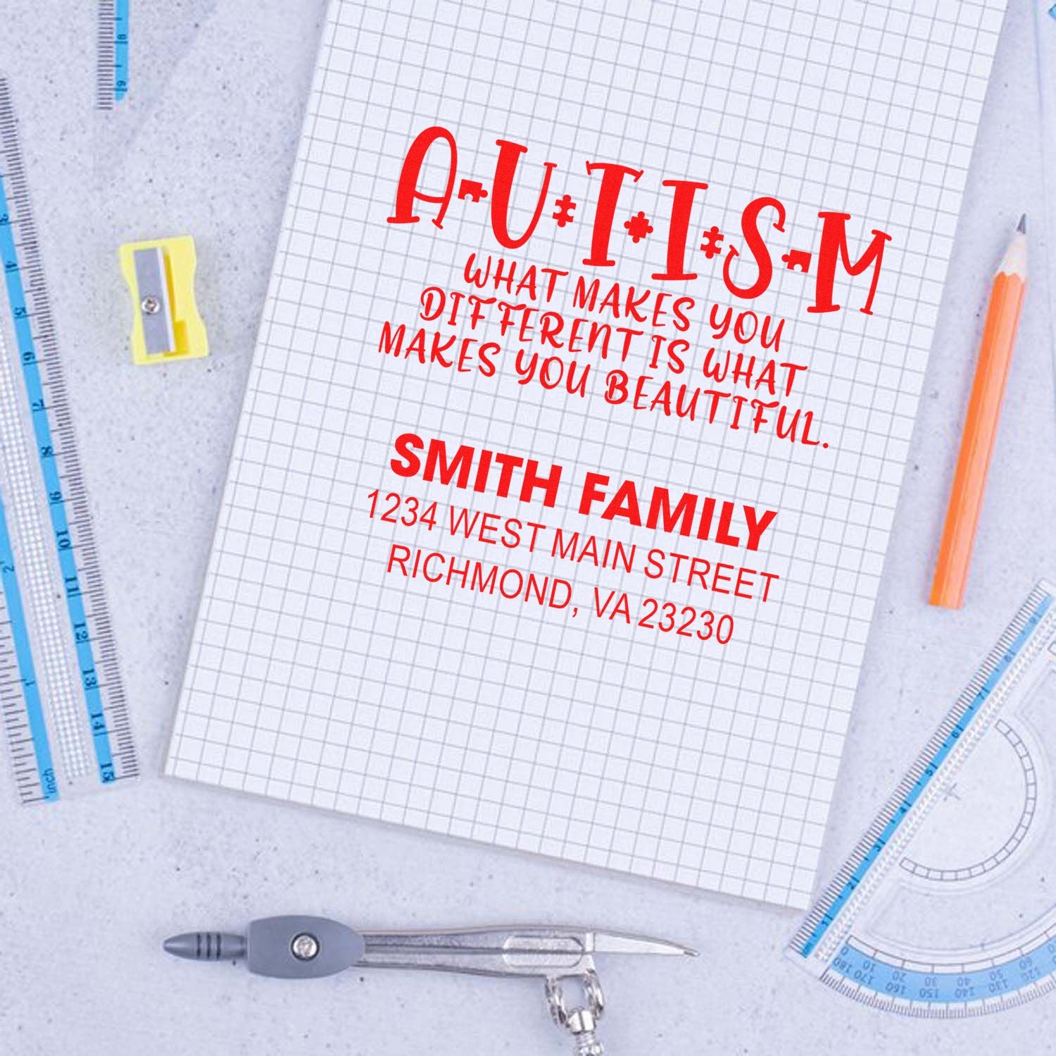 Personalized rubber stamp design with autism awareness quote and Smith family return address on graph paper.
