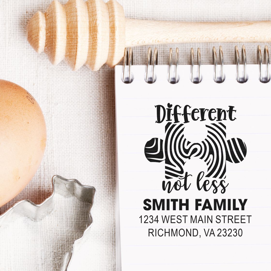 Custom autism awareness return address rubber stamp with Different not less design, family name, and mailing address.