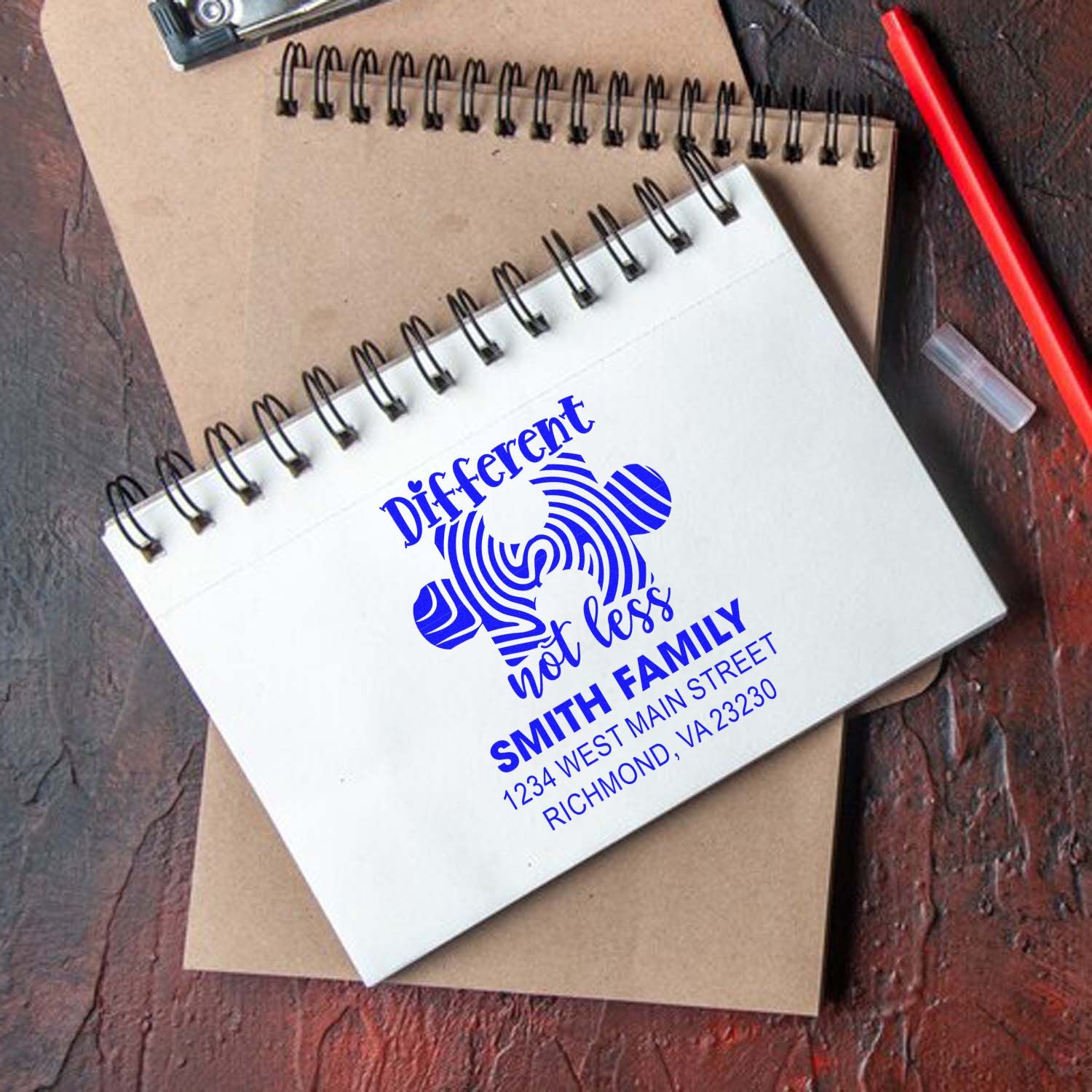 Custom rubber stamp with family return address and Different not less design, ideal for personalized stationery and mail.
