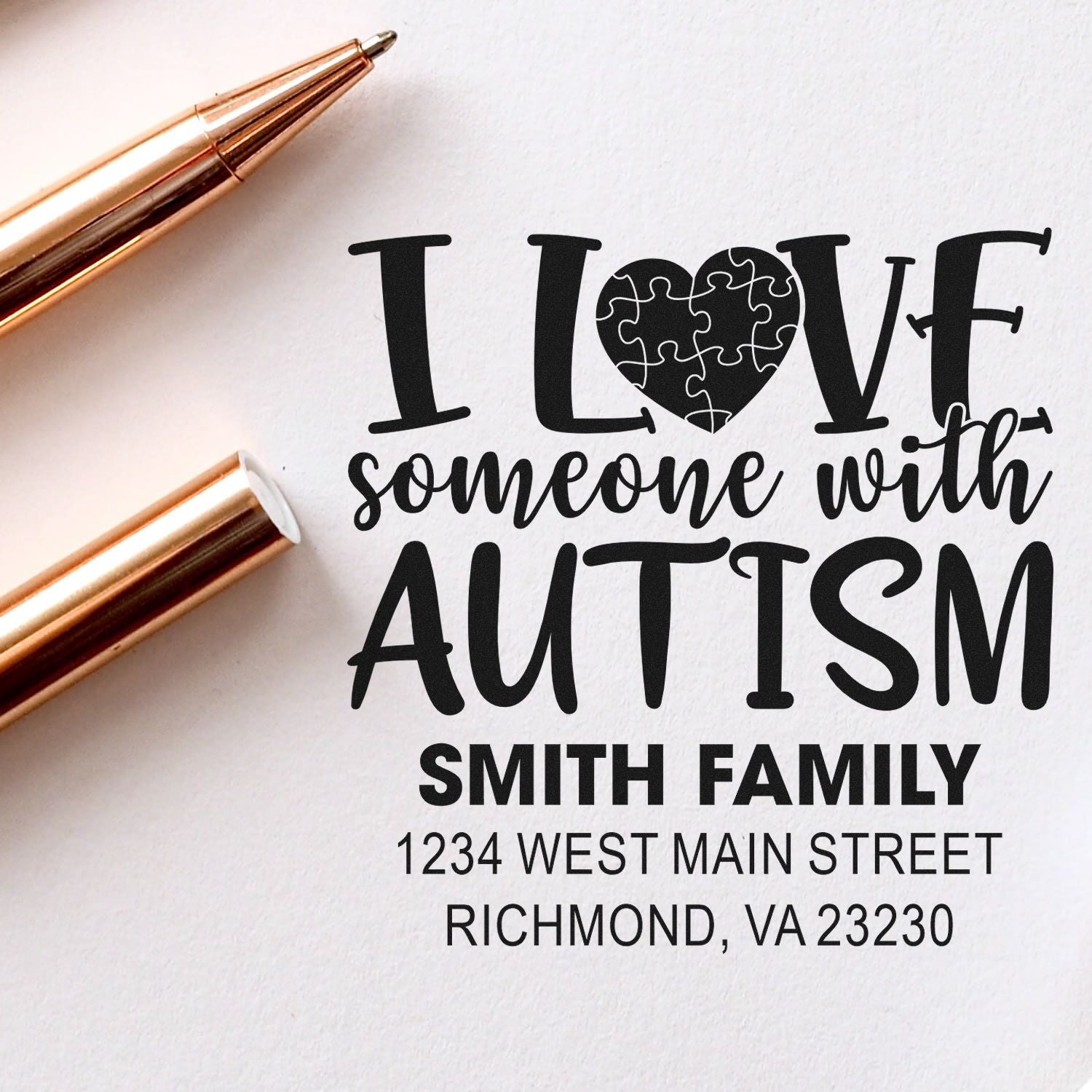 Personalized rubber stamp with autism awareness message, Smith family name, and return address.