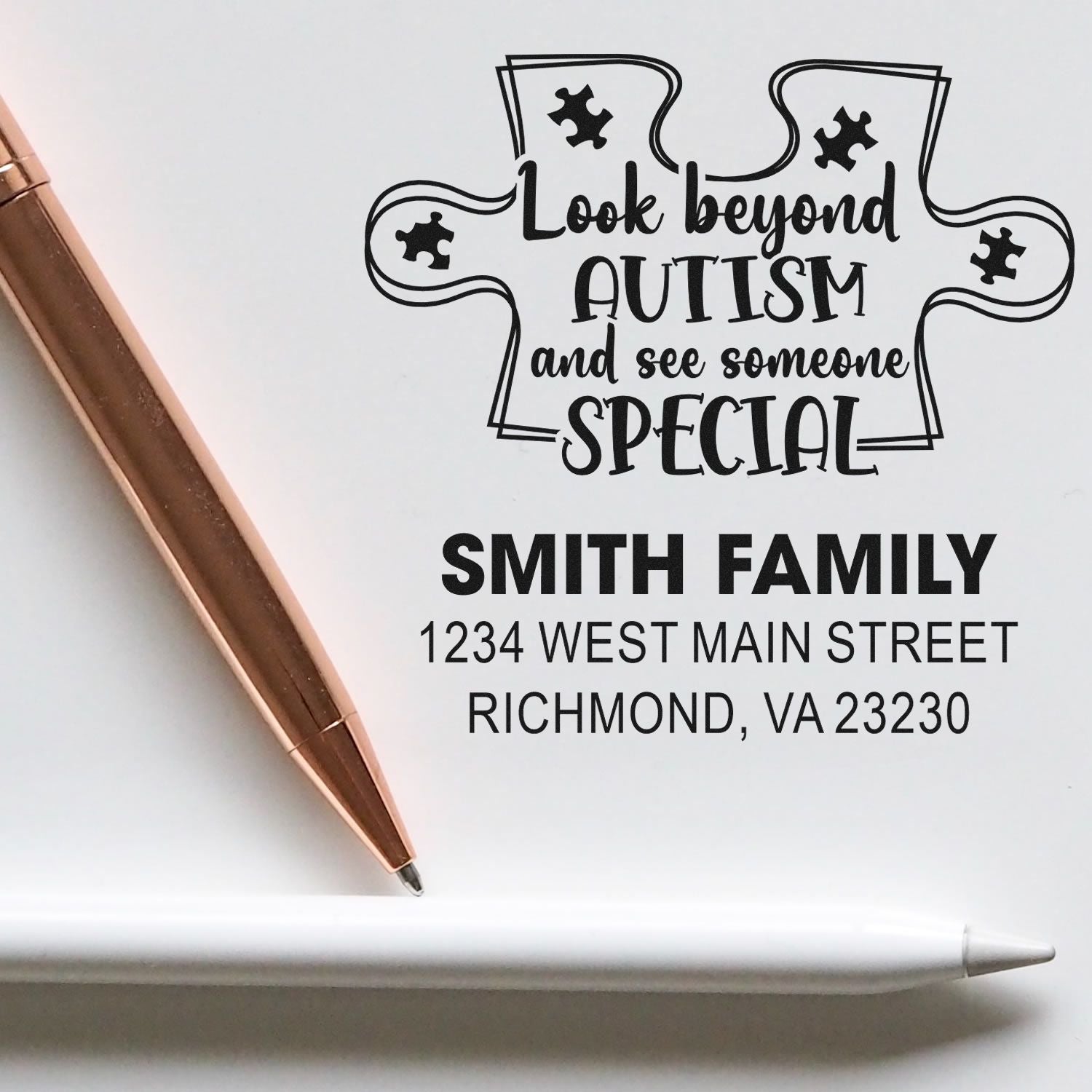 Personalized address rubber stamp with autism awareness message, Smith Family name, and return address.