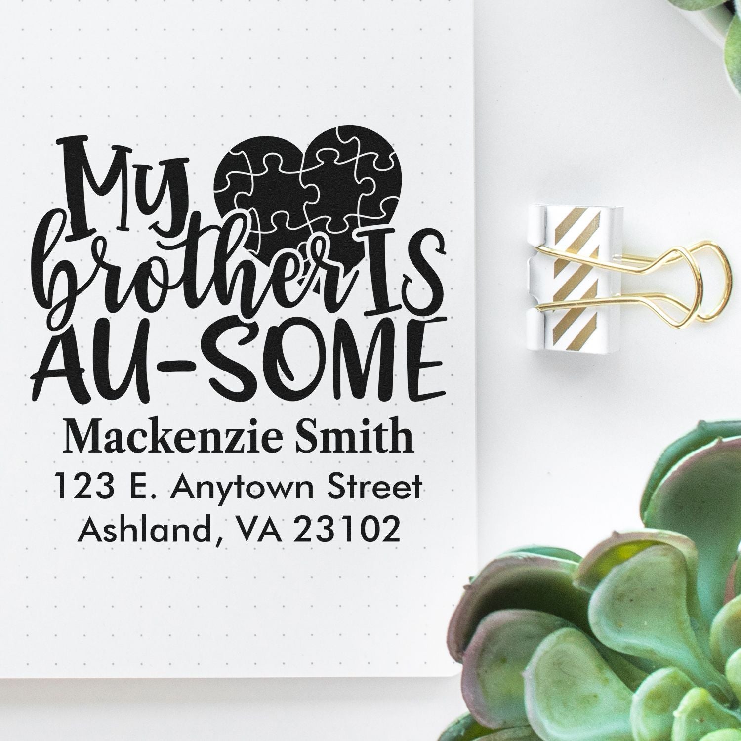 Custom rubber stamp for autism awareness featuring My brother is AU-SOME heart puzzle design with name and address.