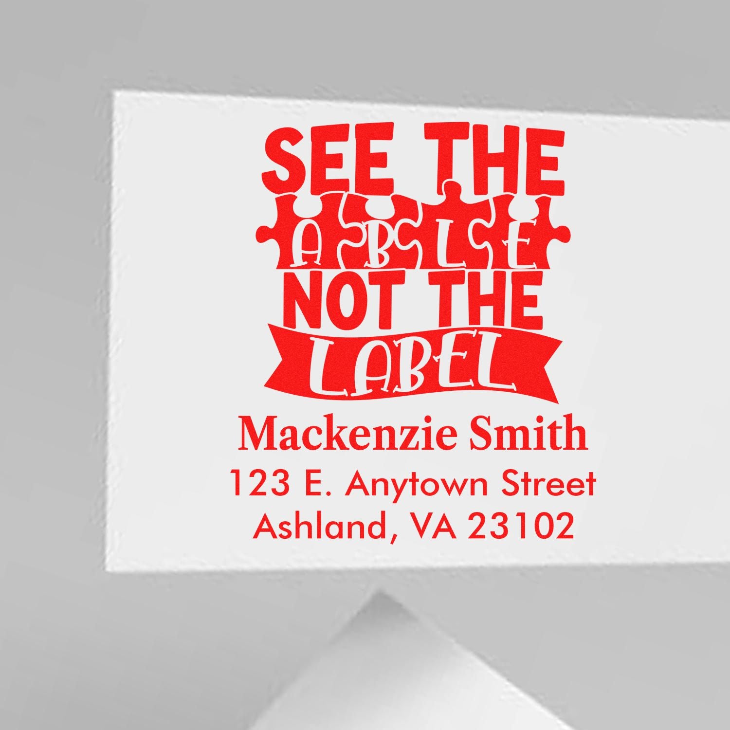Custom rubber stamp for address labels featuring See the Table Not the Label and personalized name and address.
