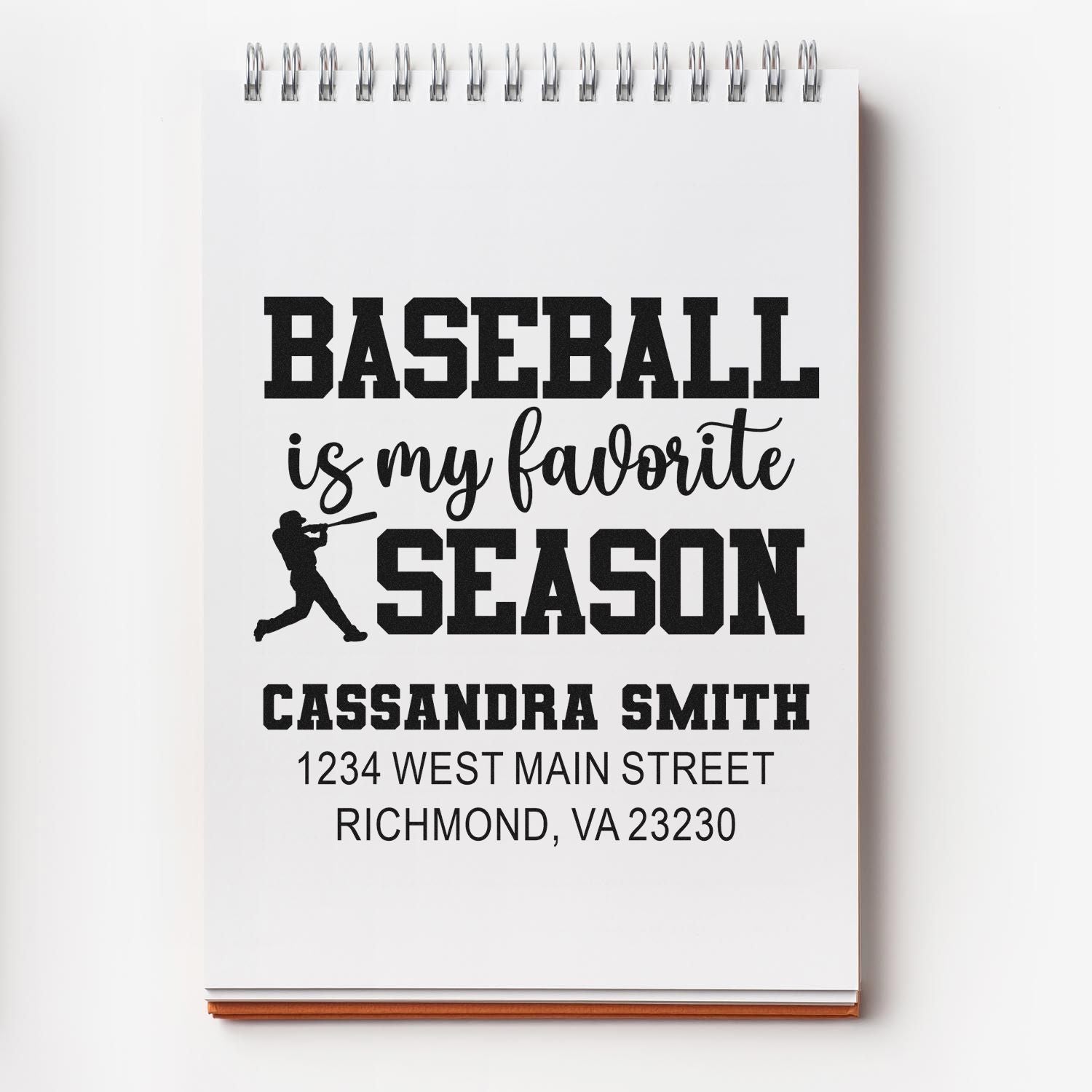 Custom baseball rubber stamp design with personalized name and address, reading "Baseball is my favorite season" on notebook mockup.