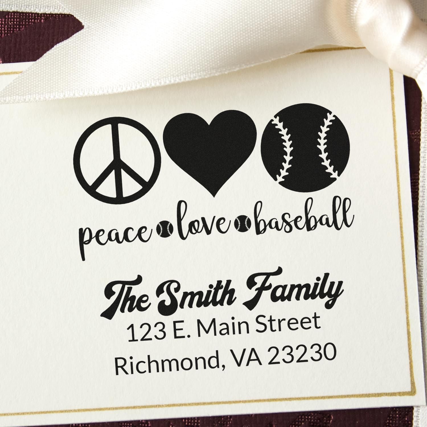 Personalized rubber stamp featuring peace, love, baseball design with custom family name and address for cards, gifts, or stationery.