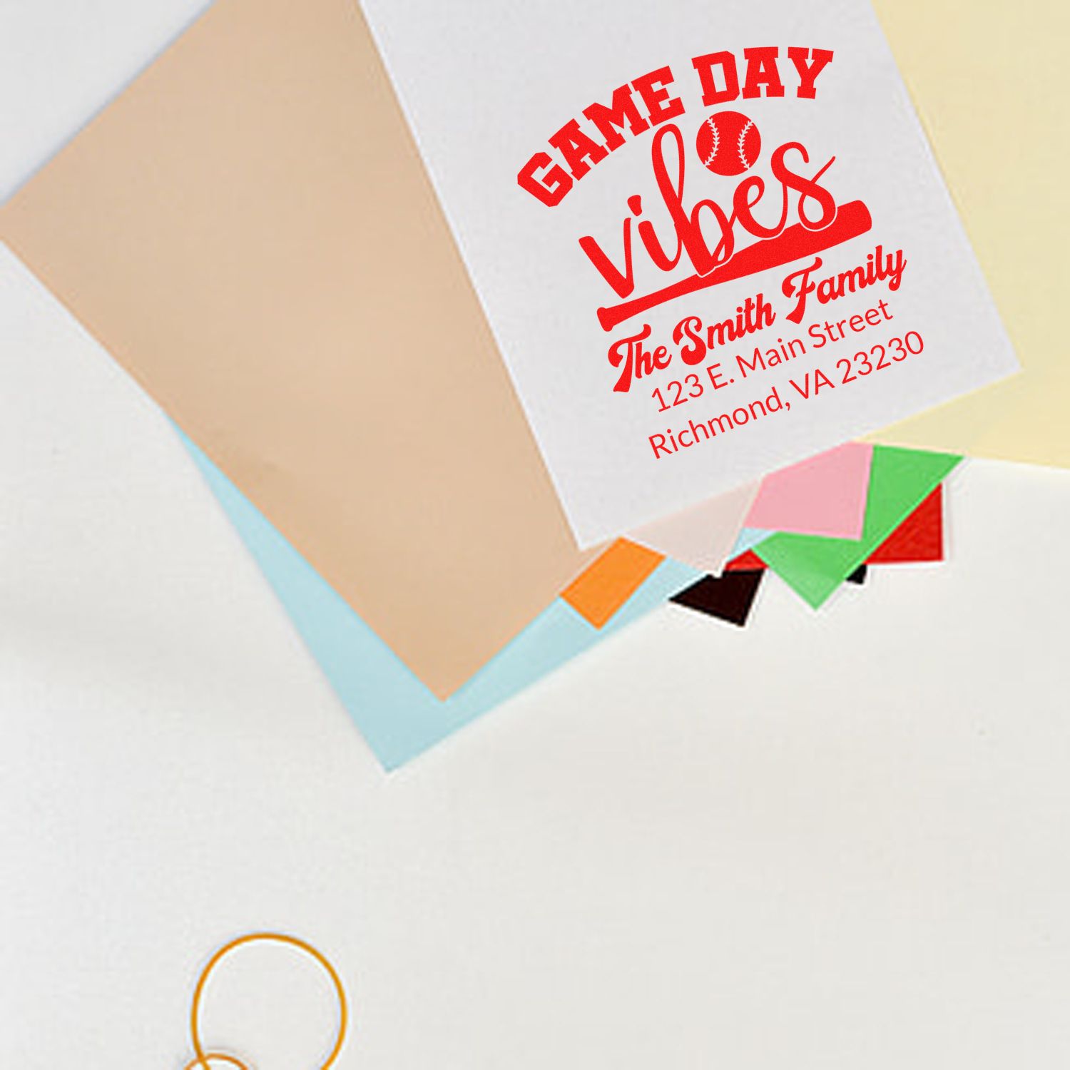 Custom baseball game day return address rubber stamp with family name on envelope, perfect for sports-themed mailings.