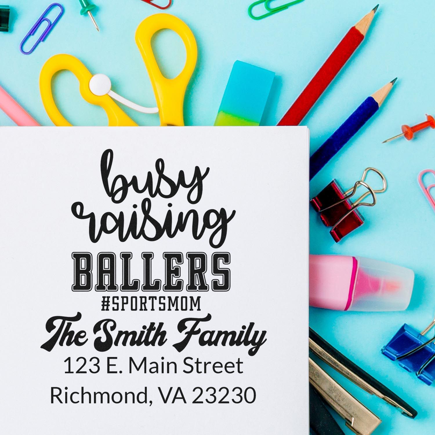 Custom rubber stamp design with Busy Raising Ballers sports mom message and The Smith Family Richmond, VA return address.